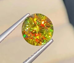Lustrous Sphene Gemstone: Multi Color Round Cut, 1.65 Carat