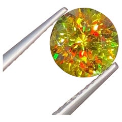 Lustrous Sphene Gemstone: Multi Color Round Cut, 1.65 Carat
