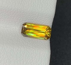 Lustrous Sphene Gemstone: MultiColor Emerald Cut, 0.90 Carat