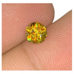 Lustrous Sphene Gemstone: MultiColor Round Cut, 0.85 Carat