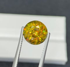 Lustrous Sphene Gemstone: MultiColor Round Cut, 4.21 Carat