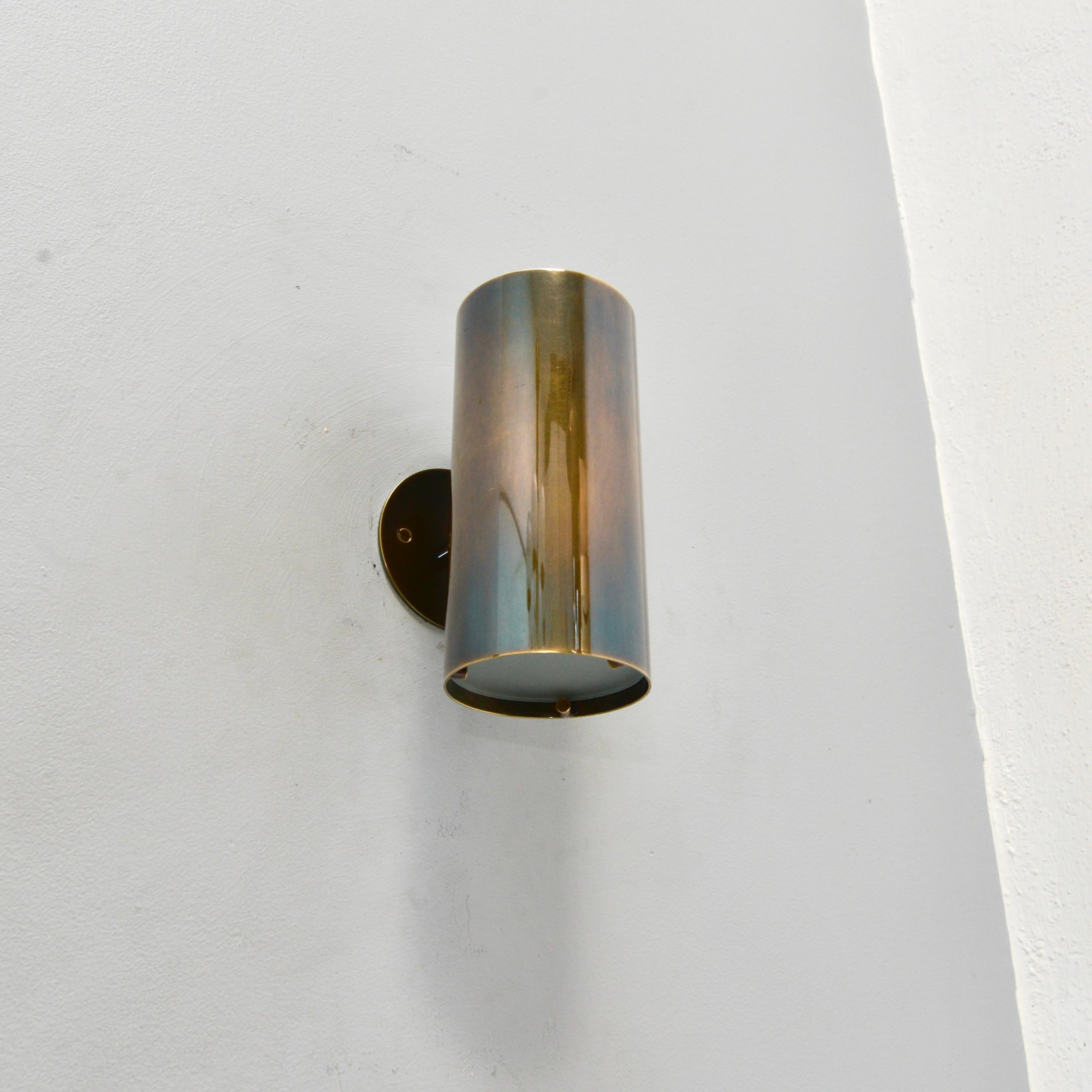 The elegant outdoor LUTE UD Sconce is an all brass wall sconce inspired by mid century Italian design. This variation of our LUTE OD sconce is an up-down version with illumination exiting both top and bottom of the sconce through a frosted glass