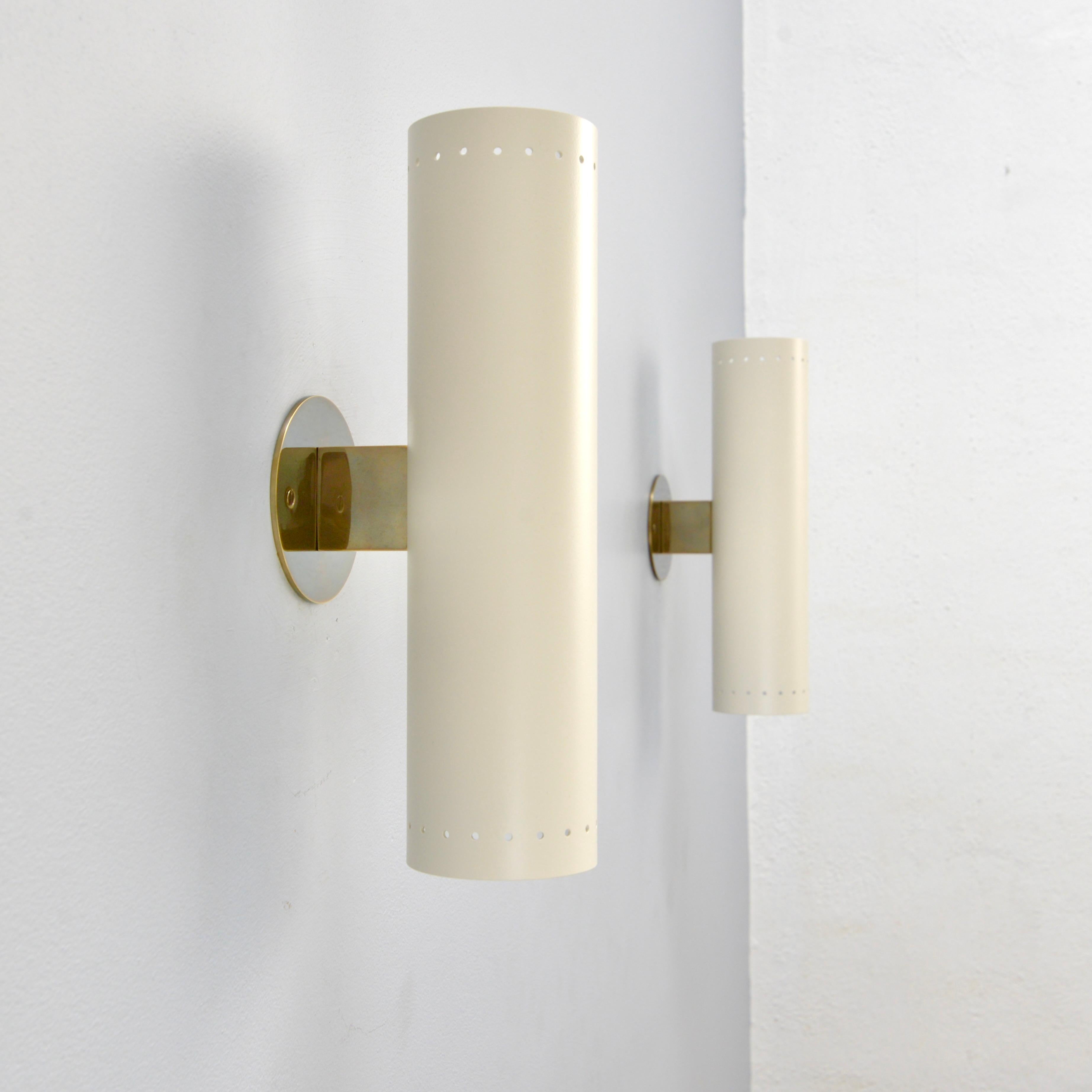 Part of our Lumfardo Luminaries contemporary collection, this Lute OW brass and painted aluminum cylinder sconce is hardwired with two E26 sockets for use in the US. It can also be wired for use anywhere in the world. Lightbulb included with