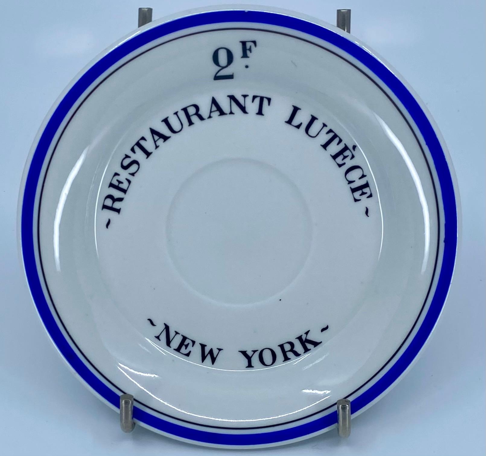 Lutèce saucer plate. Vintage blue and white saucer from the famed Lutèce restaurant from Manhattan’s more sophisticated past. Chic vide poche souvenir. Perfect Father's Day gift. France, 1960's. 

Dimensions: 5
