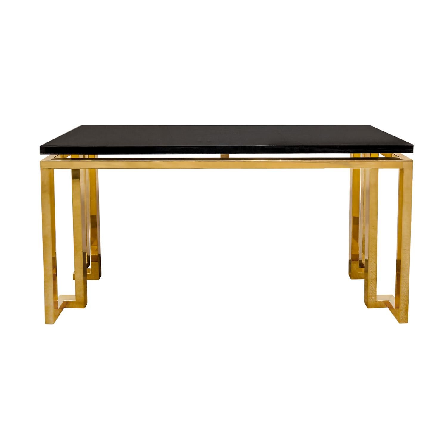 Console table with sculptural base in polished brass with high gloss black lacquer top by Luten-Clarey-Stern (LCS), American 1980's.  The top has been newly relacquered by Lobel Modern.  The combination of brass and black lacquer is super chic.