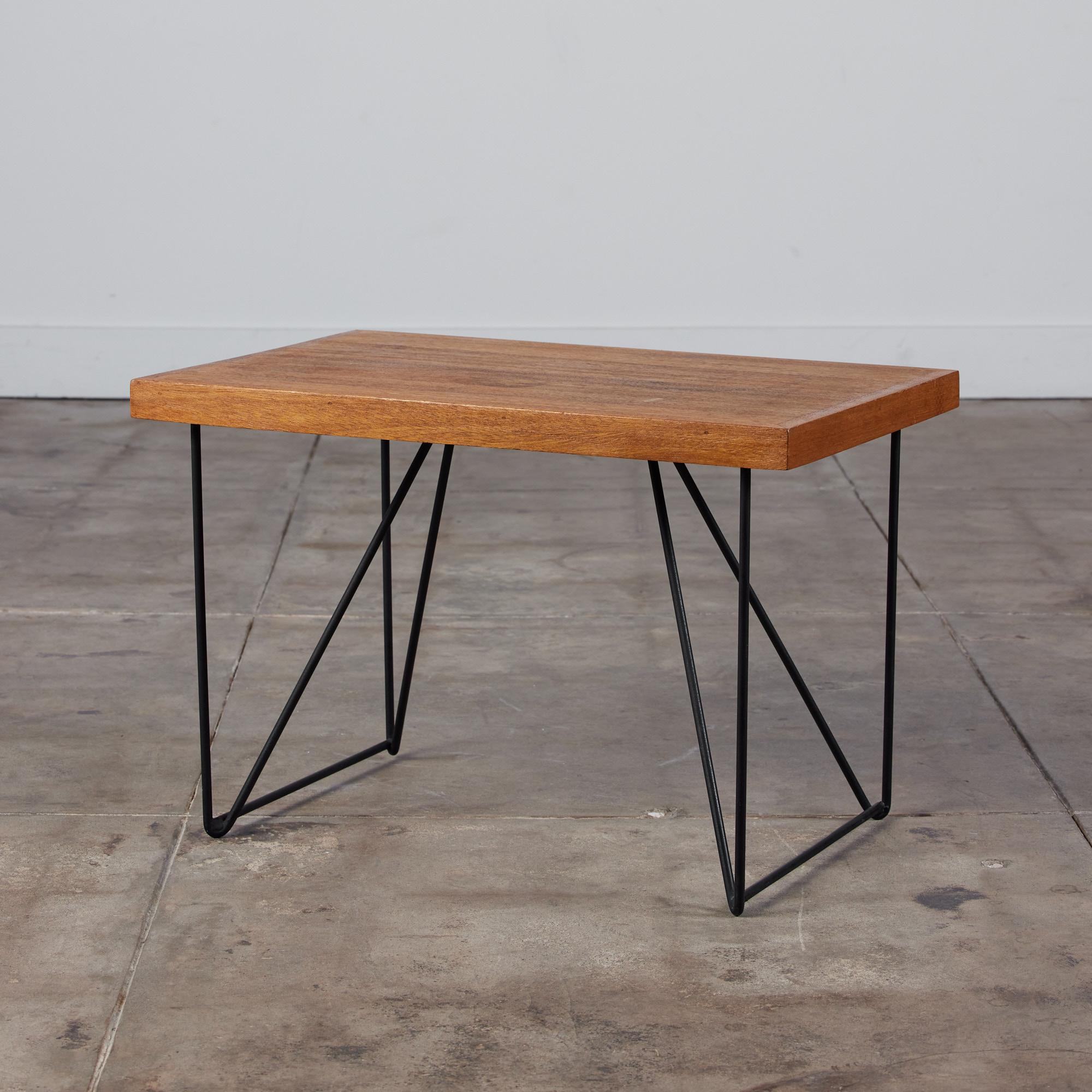A design by Luther Conover for Pacifica c.1950s, USA. This table features a rectangular mahogany table top set atop iron hairpin legs. A simplistic design that can easily be used as both a side table or coffee table.

Dimensions: 28?