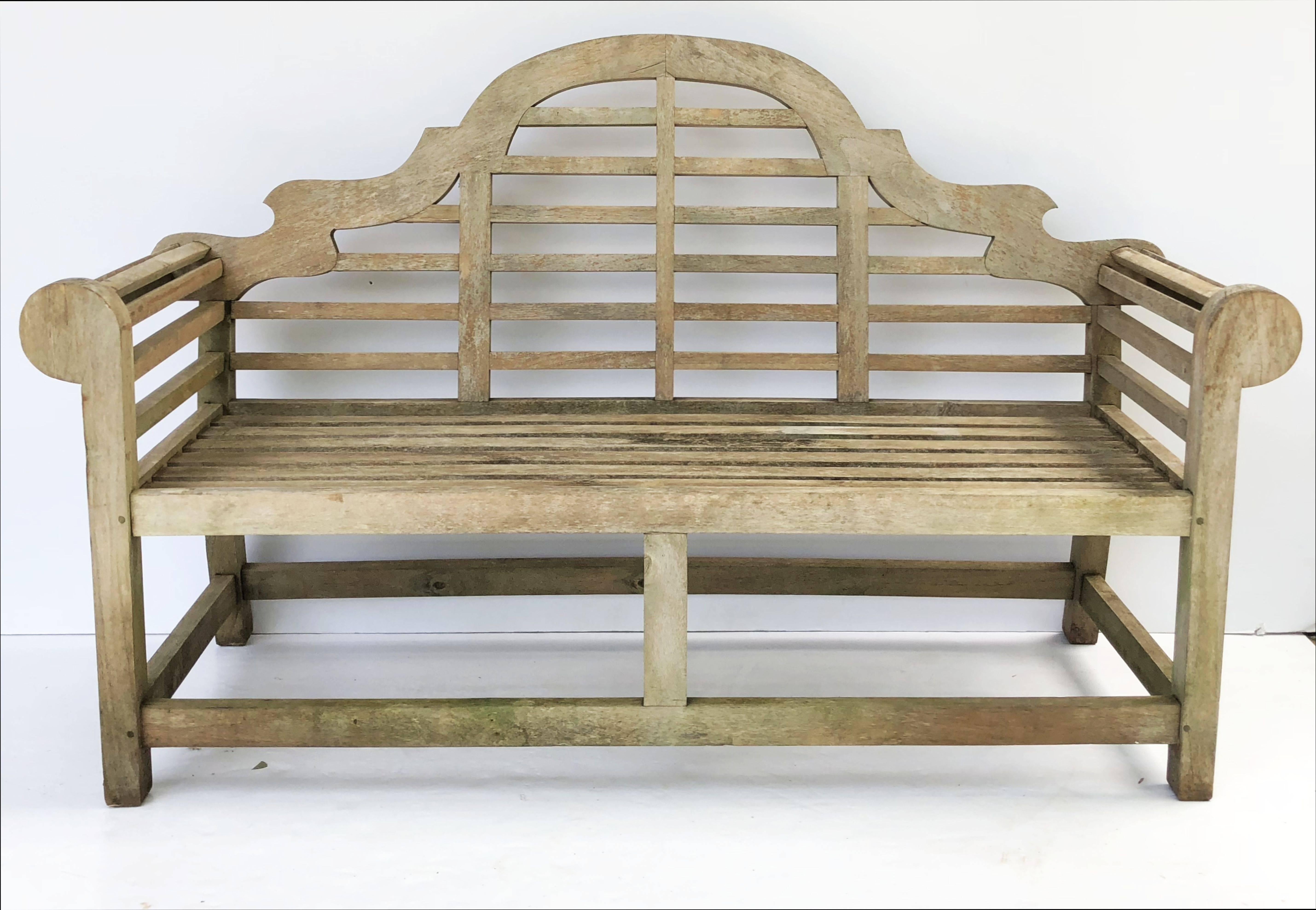 A fine near pair of vintage Lutyens style teak garden benches after Sir Edwin Lutyens, the British architect renowned for his imaginative, classic designs throughout England, Ireland and New Delhi (India).

Each bench featuring a high-arched back