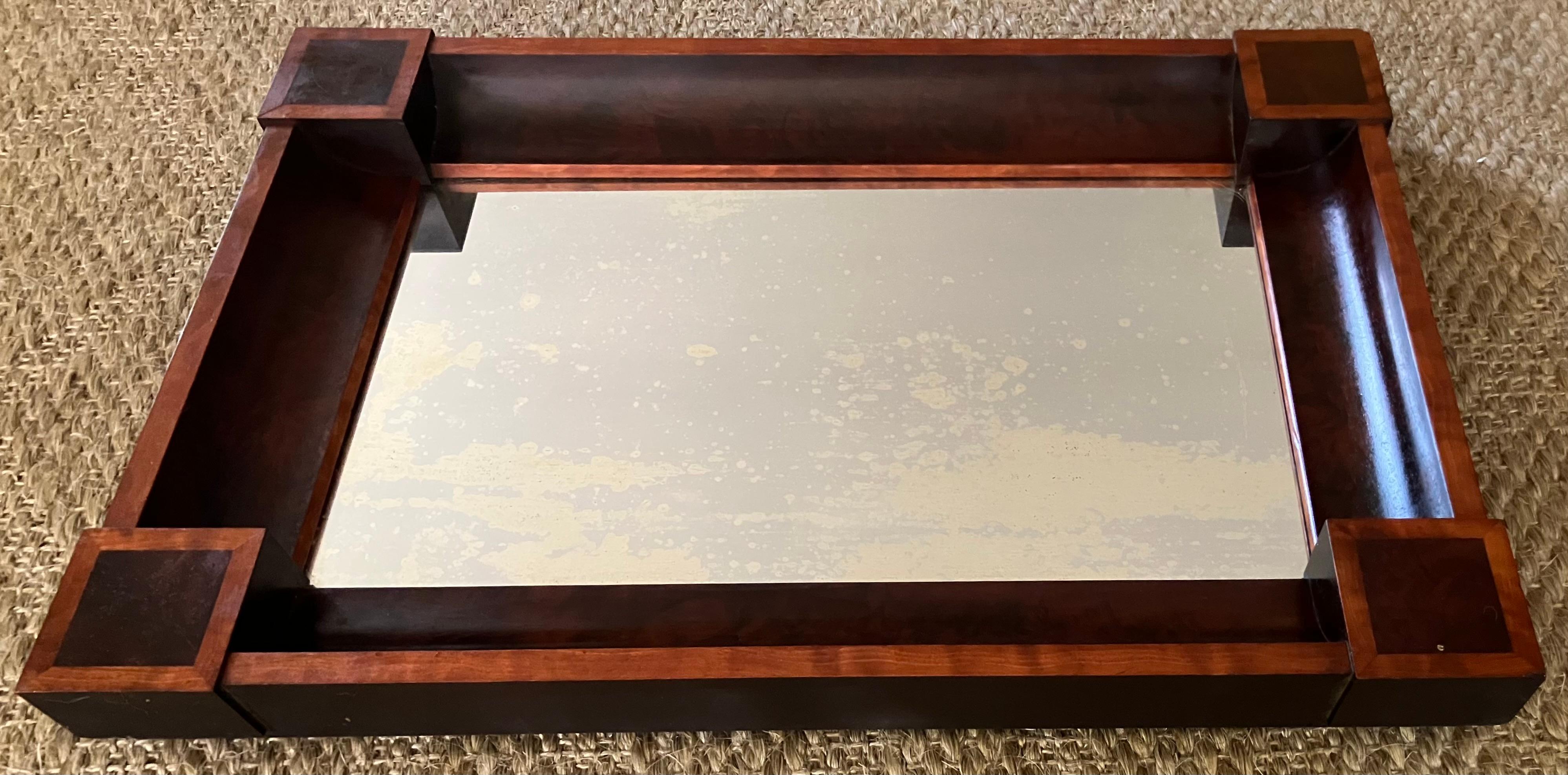 Lutyens Style Mirror.  Classical Mannerist style corner block mirror in light and dark veneers with strong incurving concave angled sides with original very subtly distressed plate glass mirror and original wood backing panel. Anticipating the