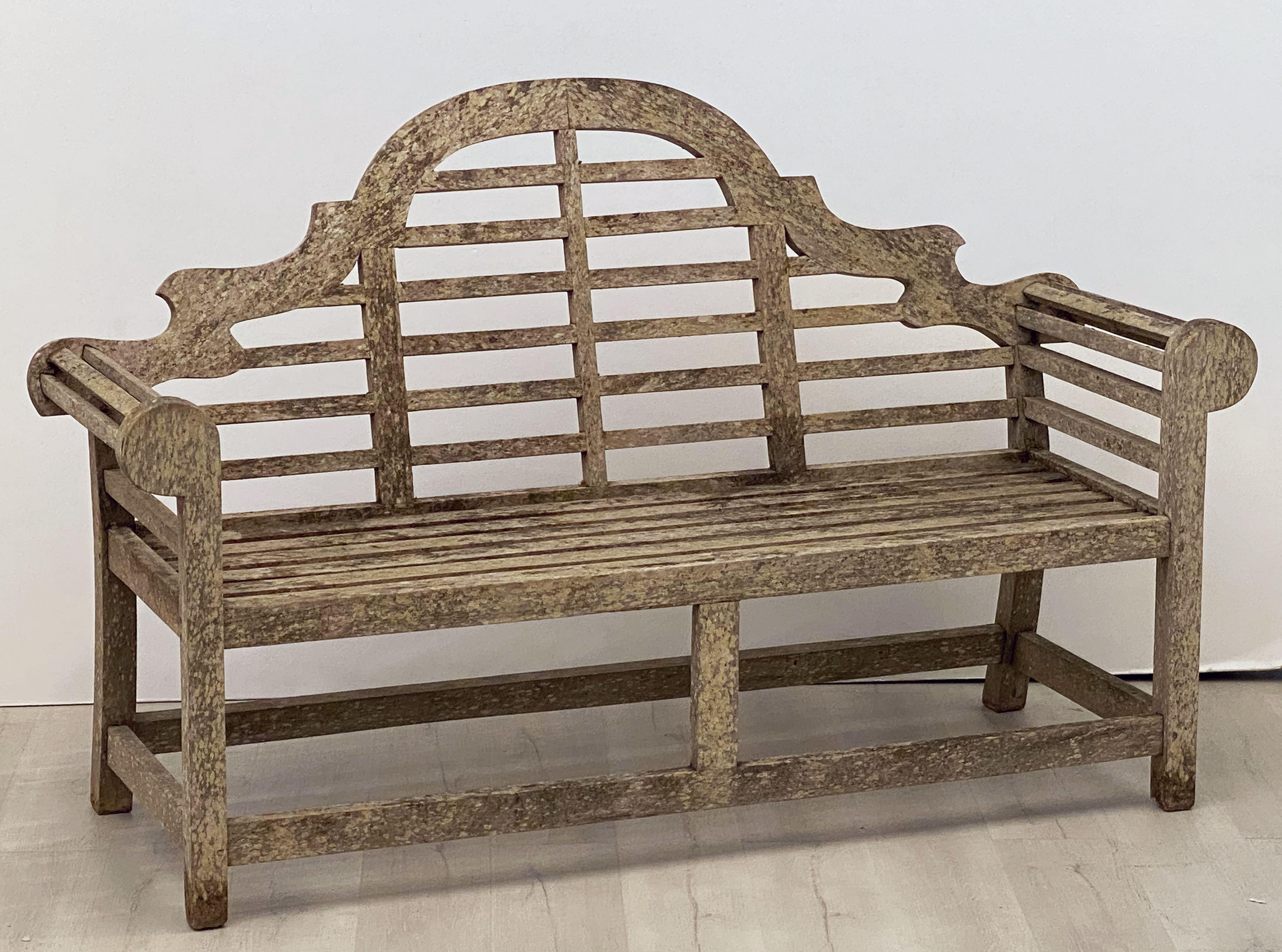 A fine vintage Lutyens style teak English garden bench after Sir Edwin Lutyens, the British architect renowned for his imaginative, classic designs throughout England, Ireland, and New Delhi (India).

Featuring a high-arched back for comfort and