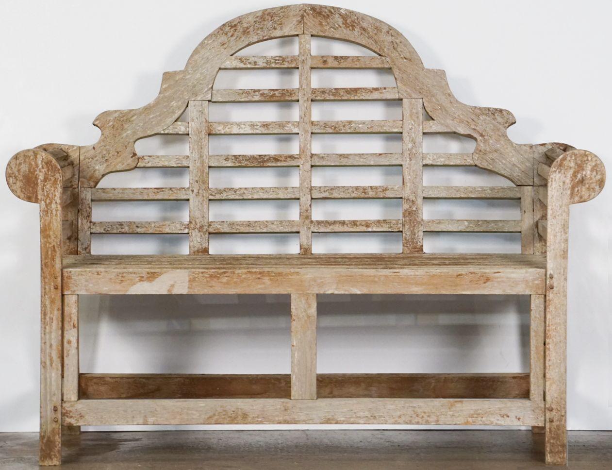 A fine vintage Lutyens style teak English garden bench after Sir Edwin Lutyens, the British architect renowned for his imaginative, classic designs throughout England, Ireland, and New Delhi (India).

Featuring a high-arched back for comfort and