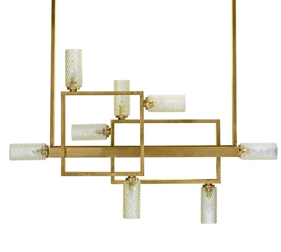 The unique design of this exquisite chandelier will imbue a contemporary home with warmth and sophistication. Used to illuminate a spacious entryway, living room, or as an accent piece in a study, this will be a bold and elegant addition to any room