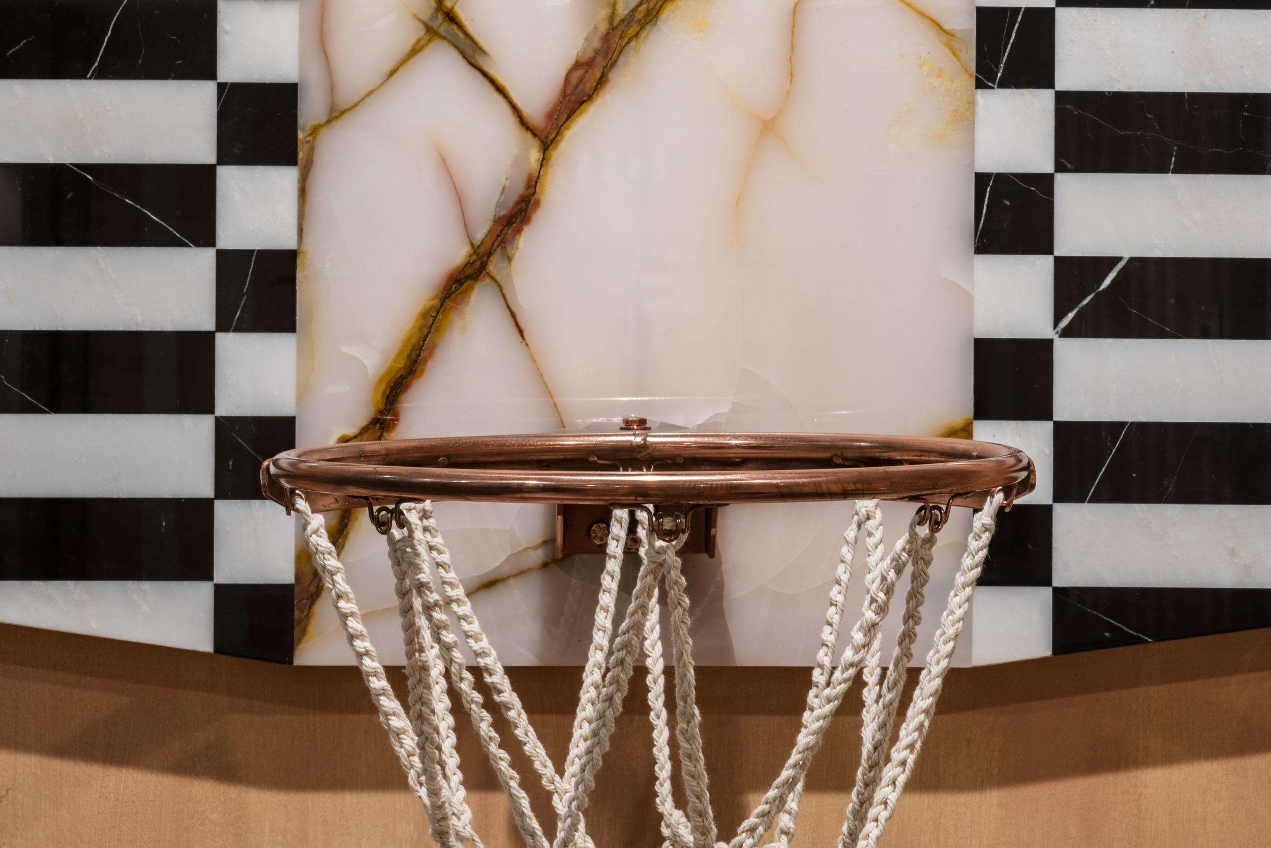 These wall-mounted basketball hoops combine marble, onyx, copper, and hand-woven cotton thread to pay homage to the ancient elements of their inspiration. Available with a square or arched ‘backboard’, these sophisticated hoops can be used to