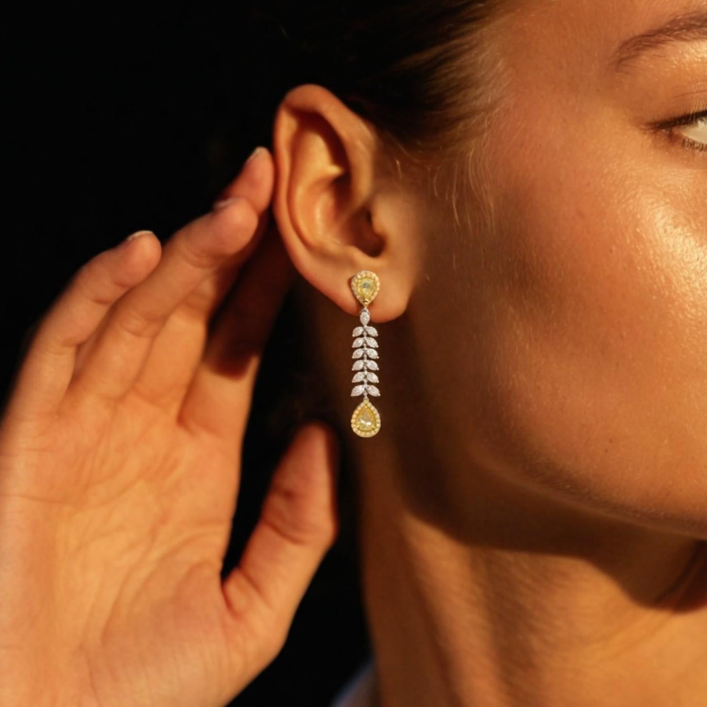 Turn heads with these stunning Golden Pear Drop Earrings, a perfect fusion of timeless elegance and modern sparkle. Featuring radiant yellow pear-shaped stones at both ends and a cascading line of dazzling white crystals in between, these earrings