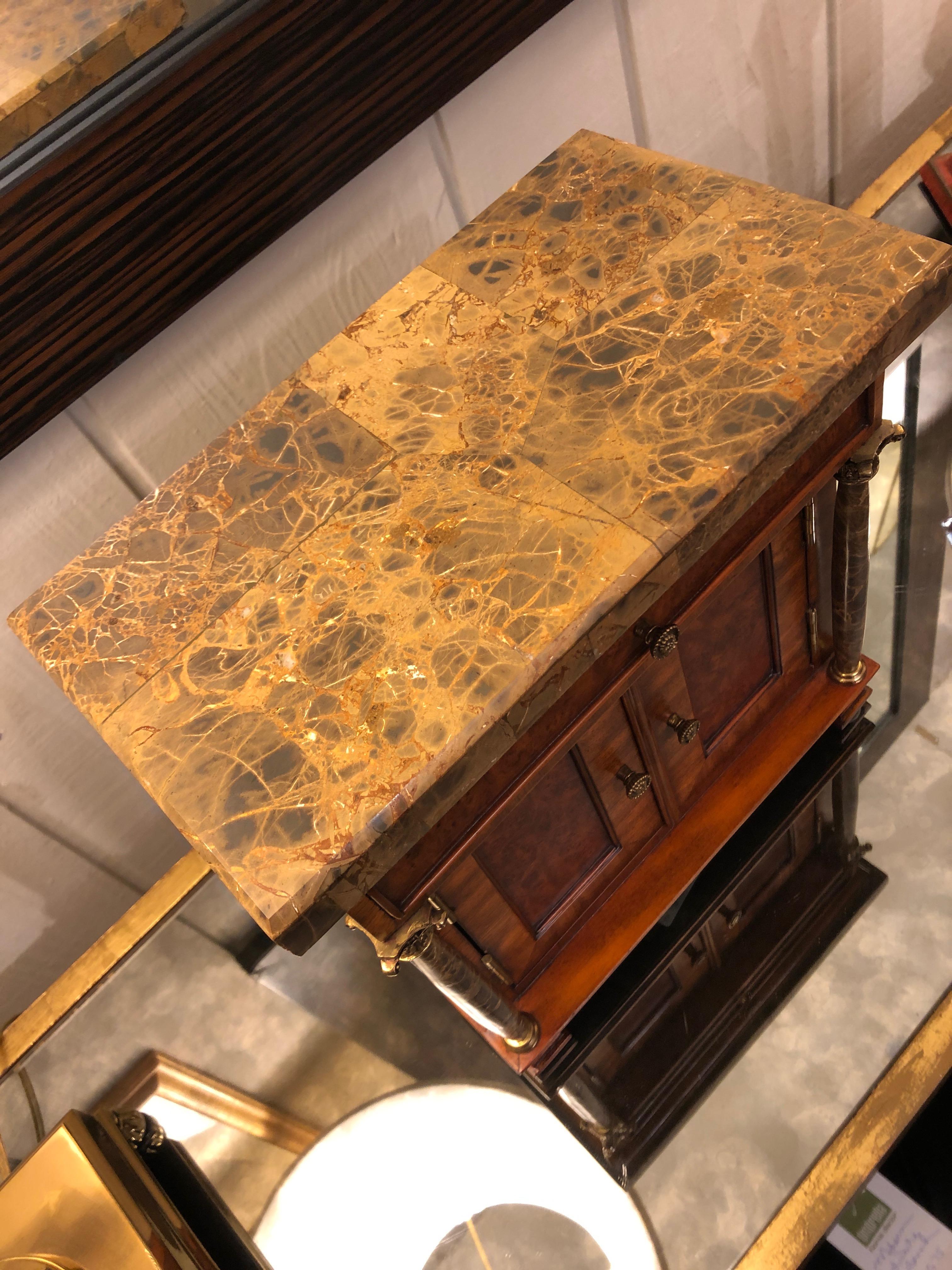 A gorgeous jewelry box or container for treasures in the shape of an antique mini credenza having a mix of burled walnut and fruitwood, marble top and decorative columns, brass embellishments, a single drawer and double doors that open to reveal