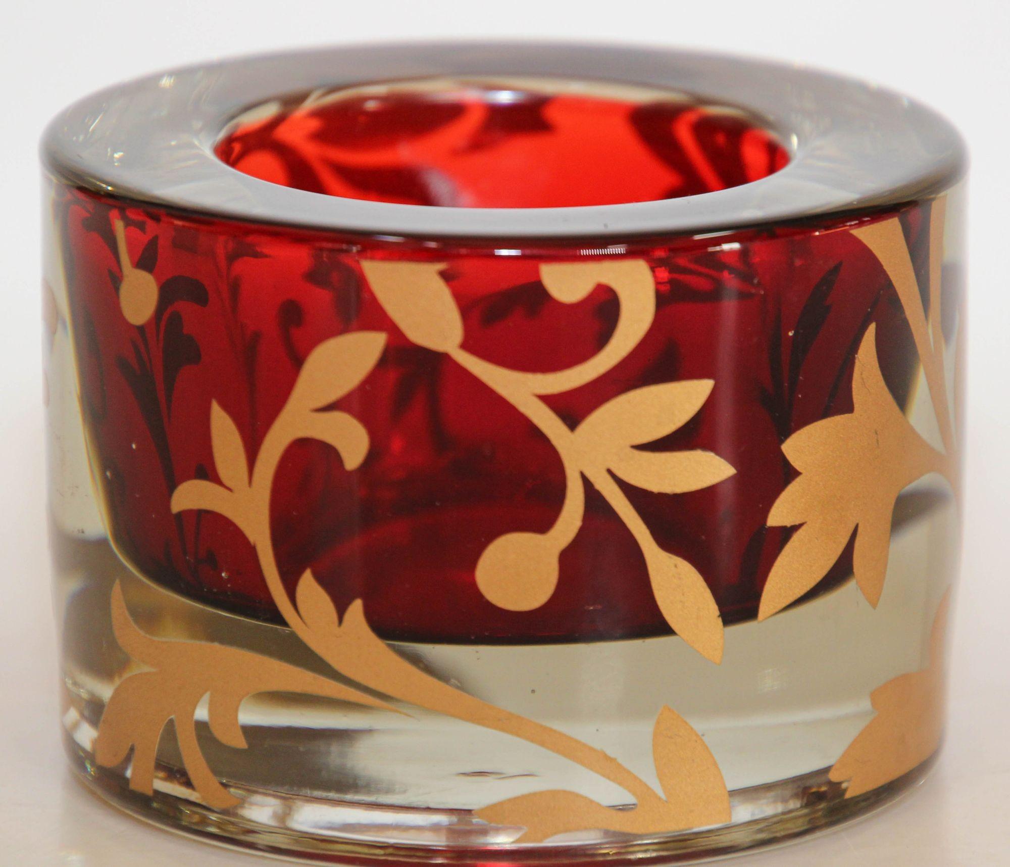 Luxe Moroccan red glass votive holder with 22k gold floral design.
Clear transparent glass with red interior and gold leaf Moorish design.
Heavy Moroccan red and gold glass votive holder luxurious look, use it as a paperweight, small ashtray or