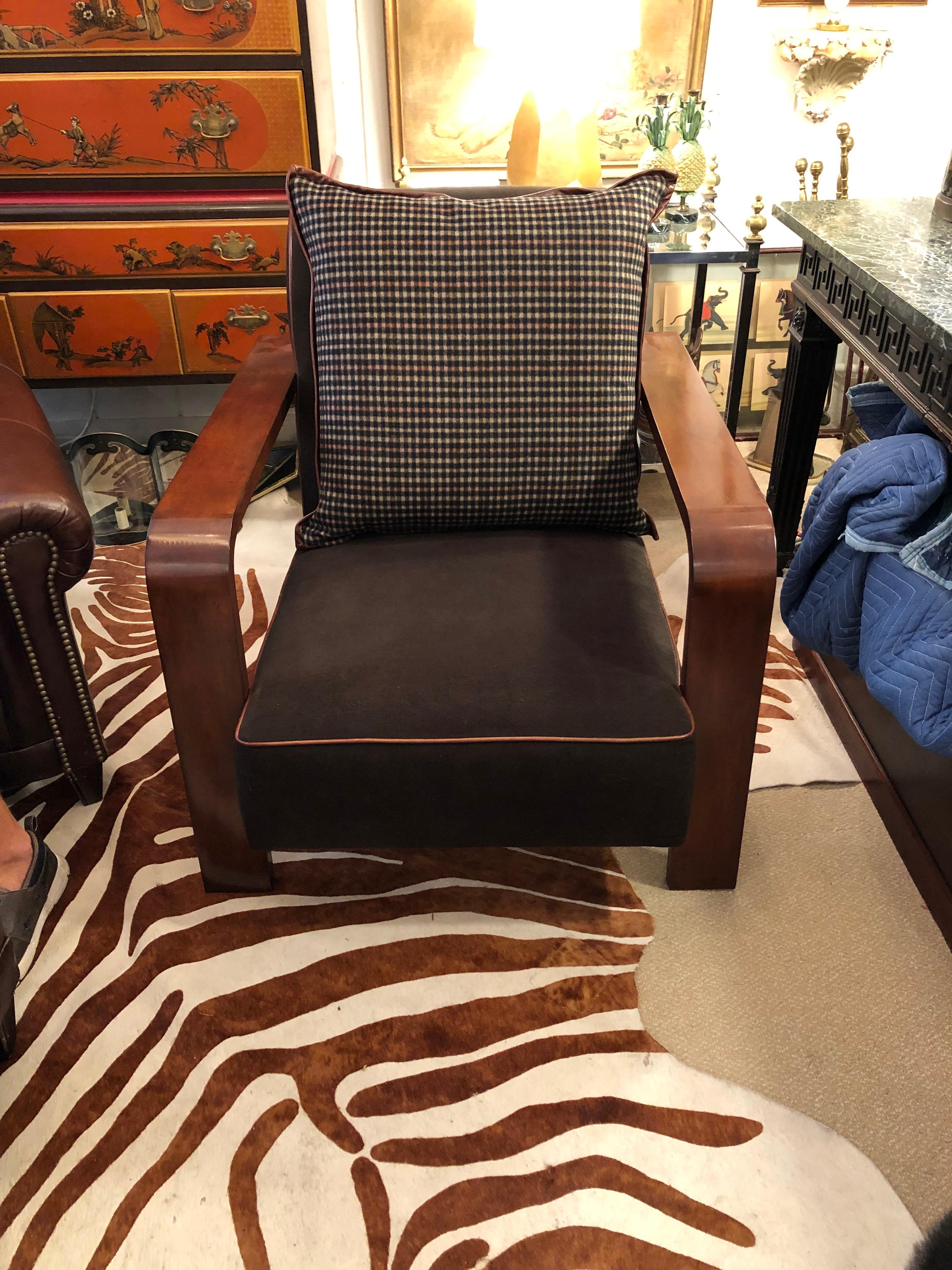 Elegant art deco inspired club chair by Ralph Lauren having beautiful glossy mahogany curvy arms, straight legs and extension back. The permanent seat and back cushions are sumptuous dark charcoal mohair with brown piping, and the generous plaid