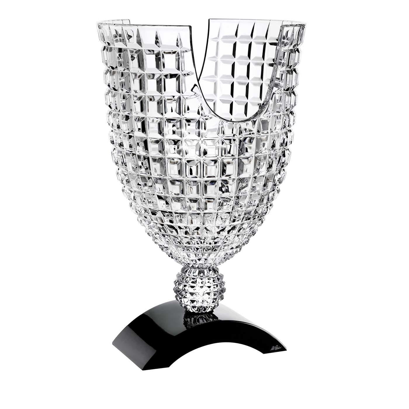 A stunning work of art, this crystal vase is a magnificent sculptural object that can be displayed anywhere in the house to imbue it with bold sophistication. The semi-arched black crystal base supports a spherical element where rests a symmetrical
