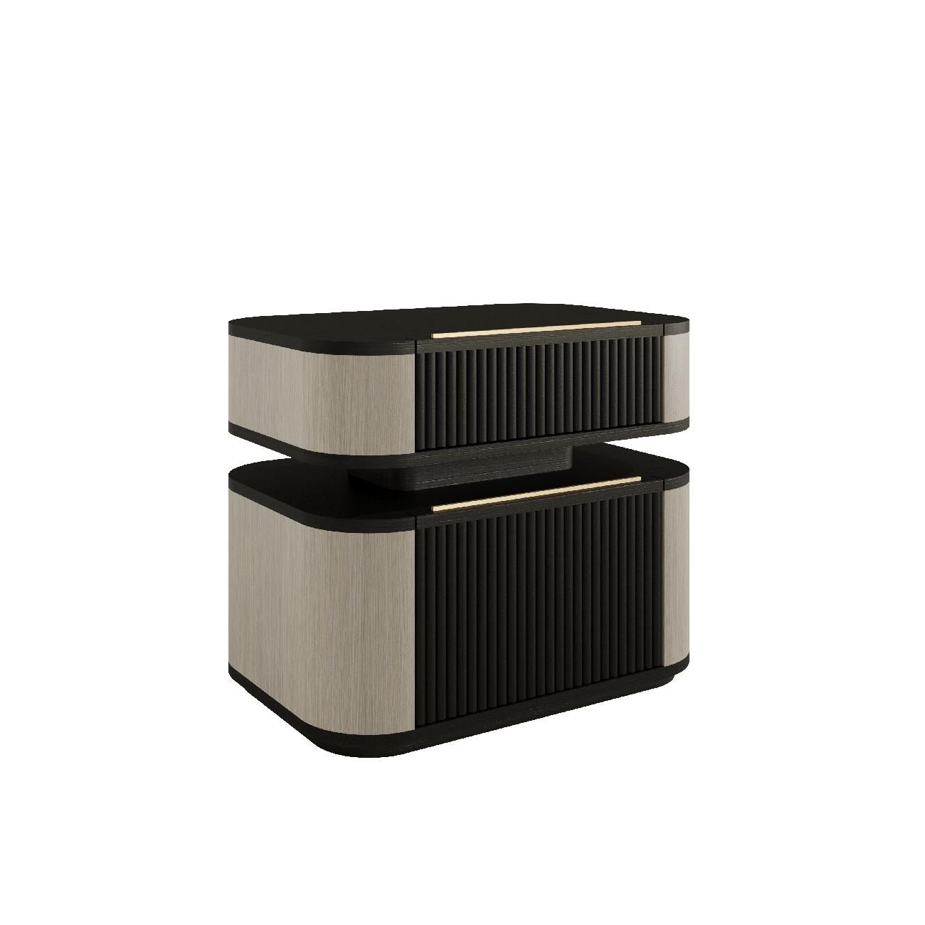 The Luxia bedside table is the definition of luxury and sophistication.

It features elegantly fluted drawer fronts that add rich texture and visual depth to the design. The drawer handles feature a subtle yet intriguing gold detail that adds to the