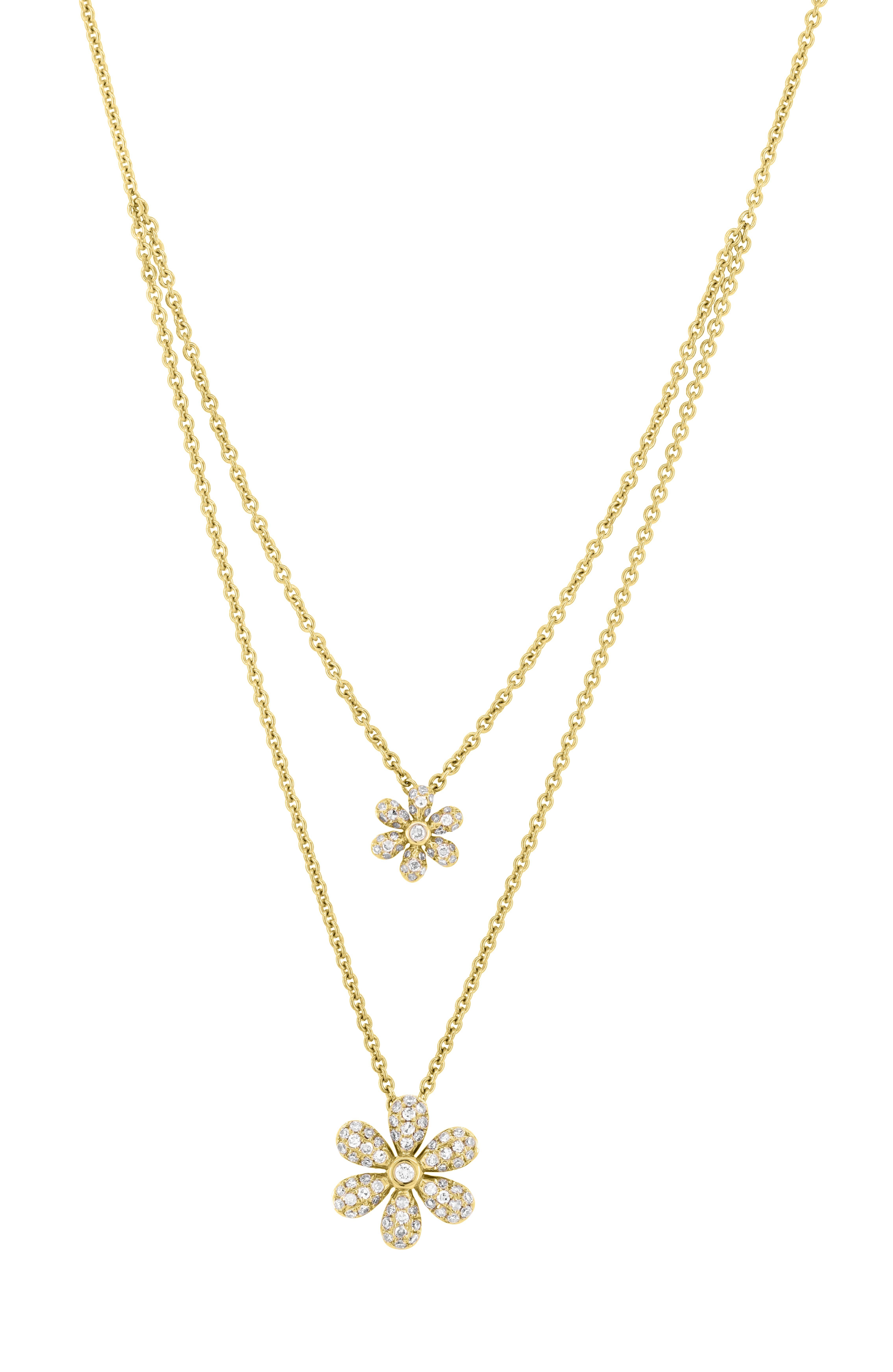 With its excellent balance of richness and imagination, this Luxle double-strand necklace will melt your heart. Better than fresh flowers, this necklace blooms with two flowers sparked by .24 ct. t.w. diamonds in polished 18k yellow gold. The flower