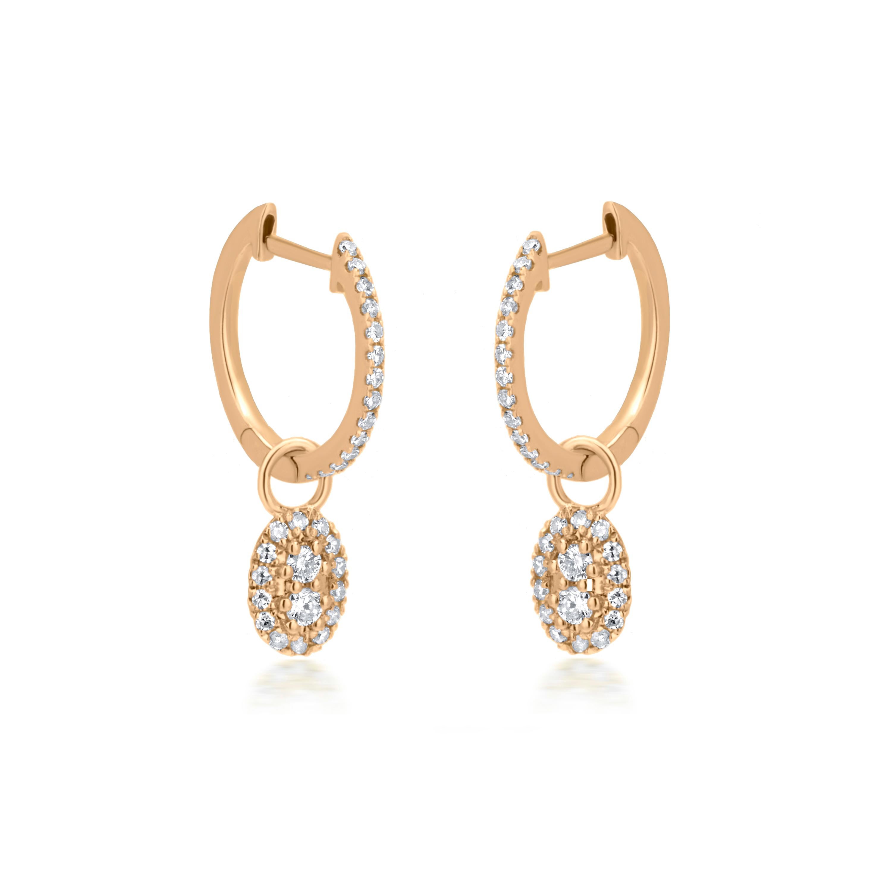 These meaningful earrings crafted in 18K yellow gold, have stunning hoop earrings showcase a oval-shaped drop adorned with dazzling diamonds. At the center of the drop, two prong-set diamonds, featuring GH color are surrounded by a halo of smaller