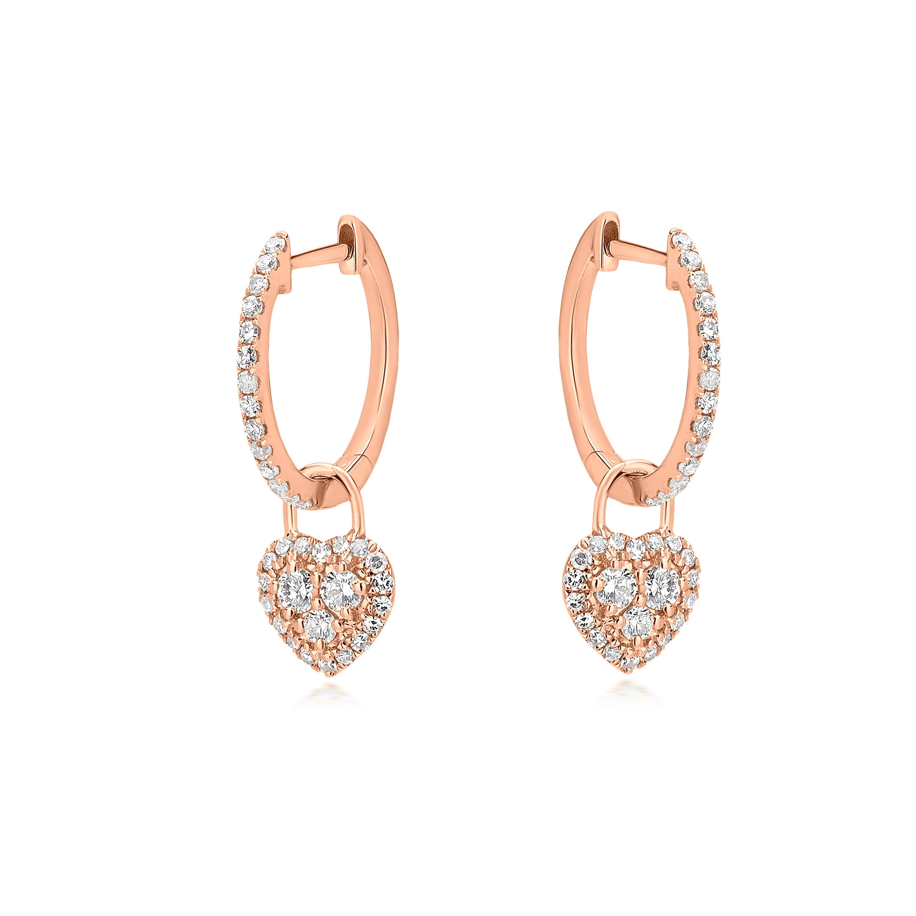 These Luxle heart hoop drop earrings, fashioned of 18k rose gold and sparkling diamonds, will make a lovely statement. A piece with diamond settings is the center of the heart motif. These lobe-hugging earrings have a sweet heart drop that sways
