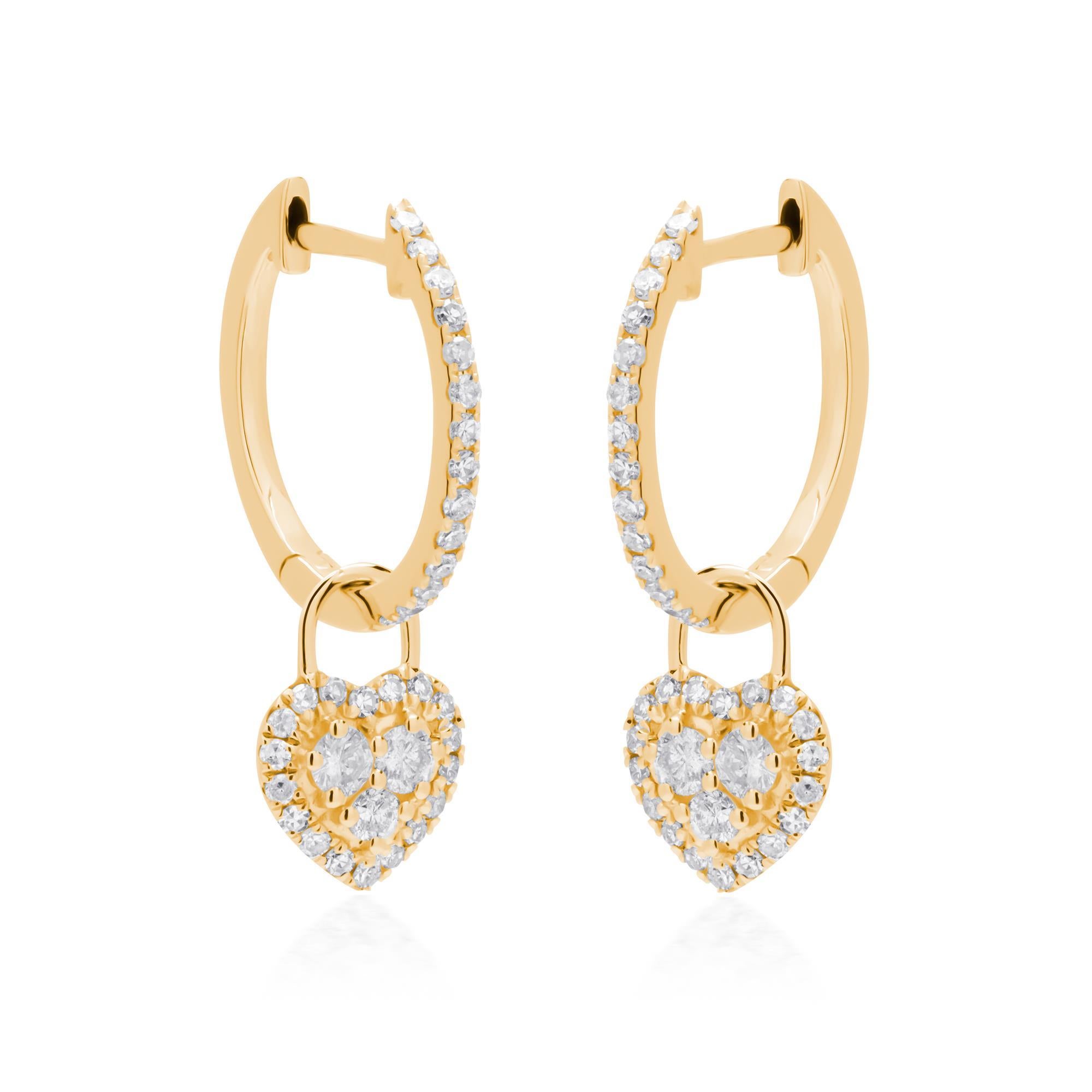 These enchanting 14K yellow gold hoop earrings feature a captivating heart-shaped pendant adorned with sparkling diamonds. At the center of the heart, a collection of round diamonds, cut to full brilliance and graded GH for color is elegantly set.