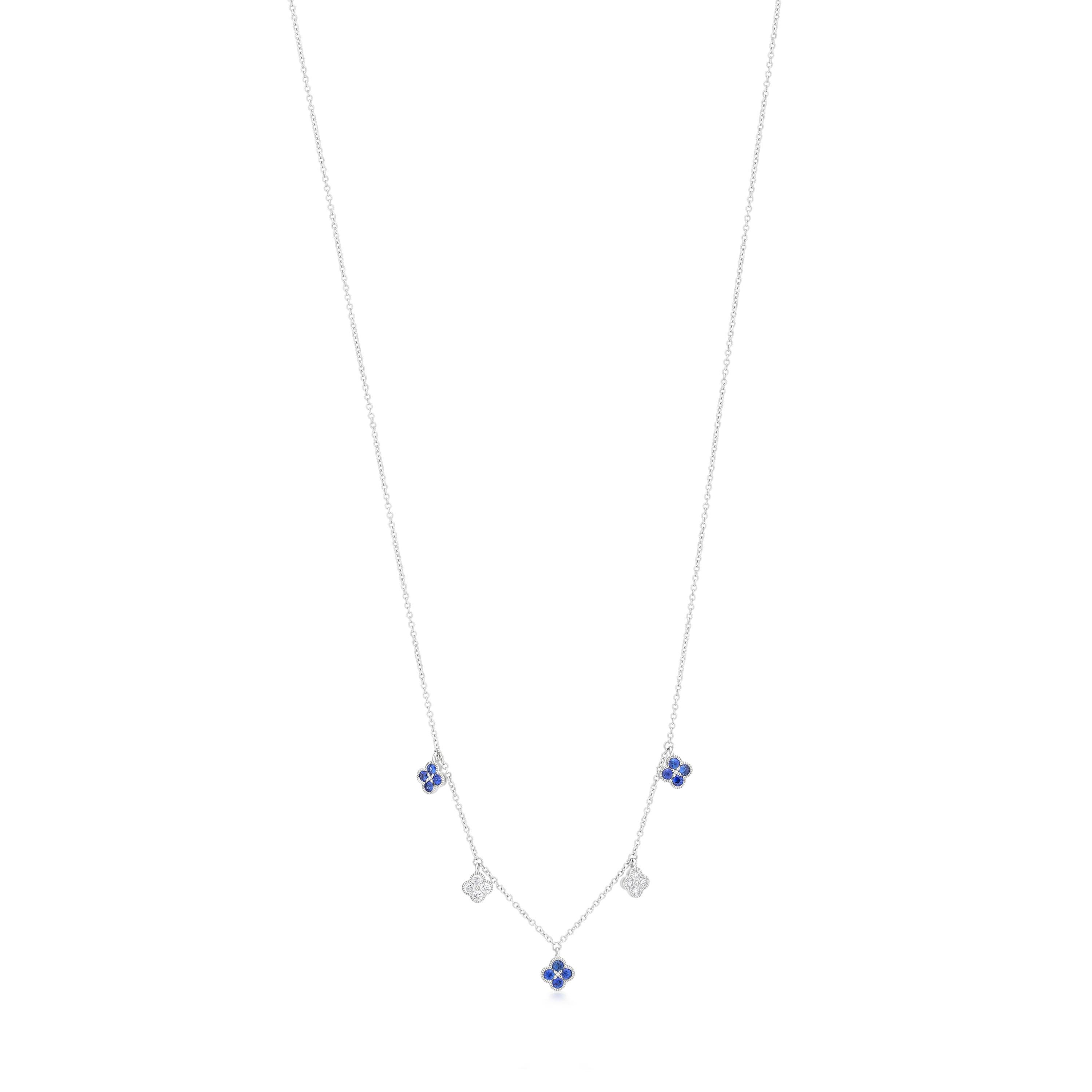 Ascend your everyday style with this stunning Blue Sapphire and Diamond station Necklace features clover drops. The chain features five clover shaped charms, alternating between four vibrant blue sapphires and exquisite diamond . Each charm is
