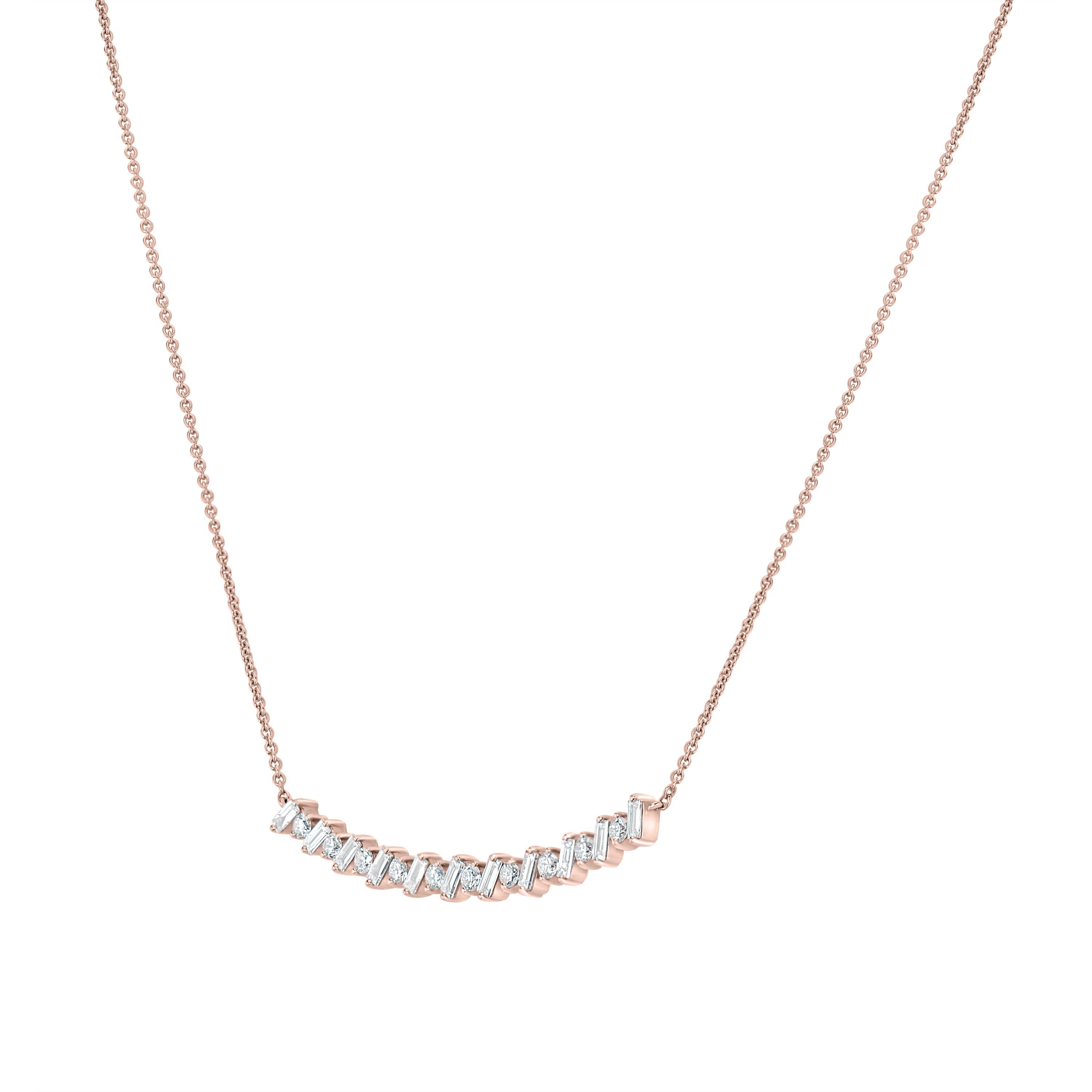 The Round and Baguette Diamond Curve Pendant Necklace will definitely put a smile on your face. Crafted by Luxle in 18K rose gold, the pendant shimmers with baguette and round diamonds totaling 0.50 Cts alternating in a curve. The pendant is