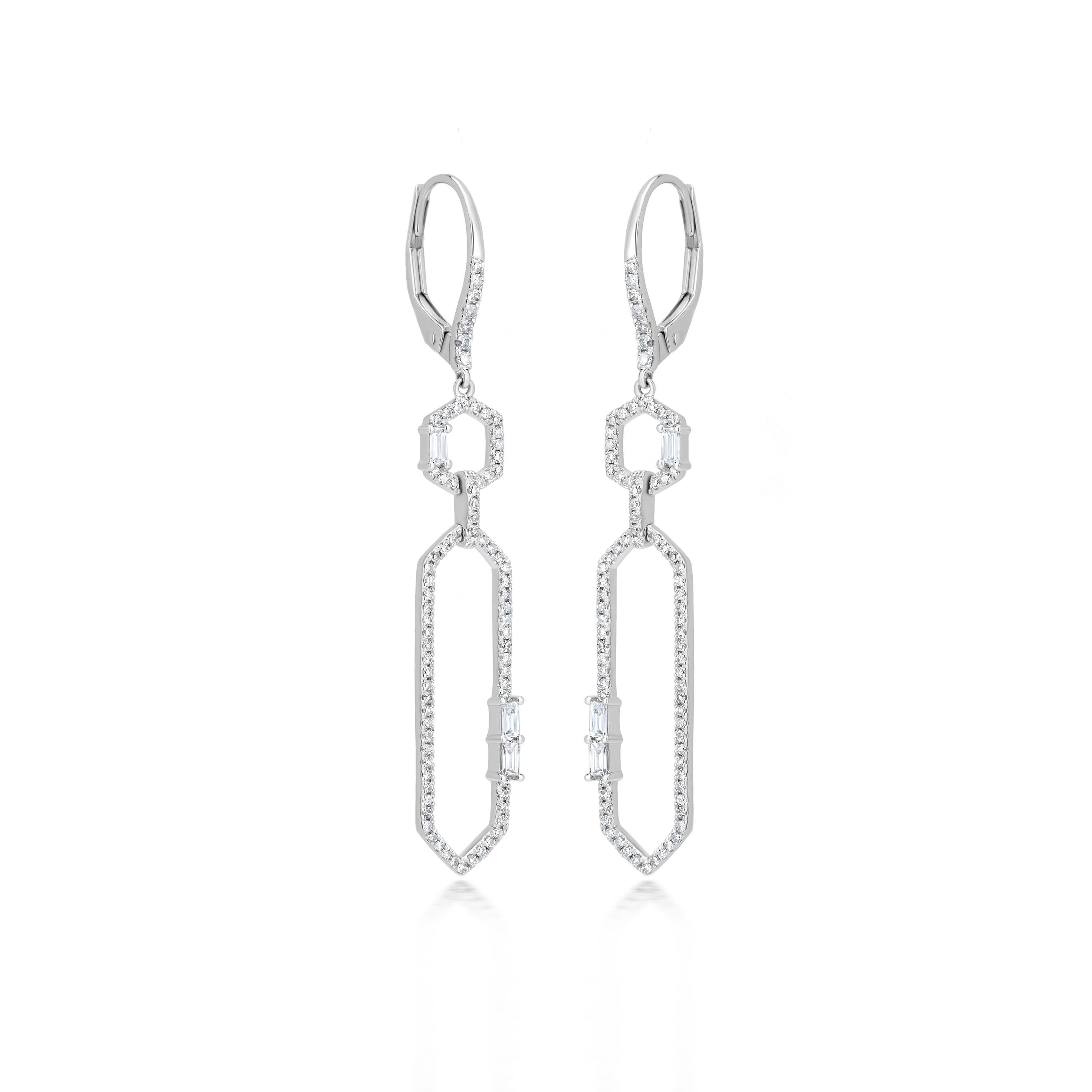Elevate your style with these stunning Geometric Diamond Drop Earrings. Featuring a unique geometric design, these earrings are crafted with shimmering diamonds set in a sleek 14K gold setting. The design showcases interlocking between two hexagons: