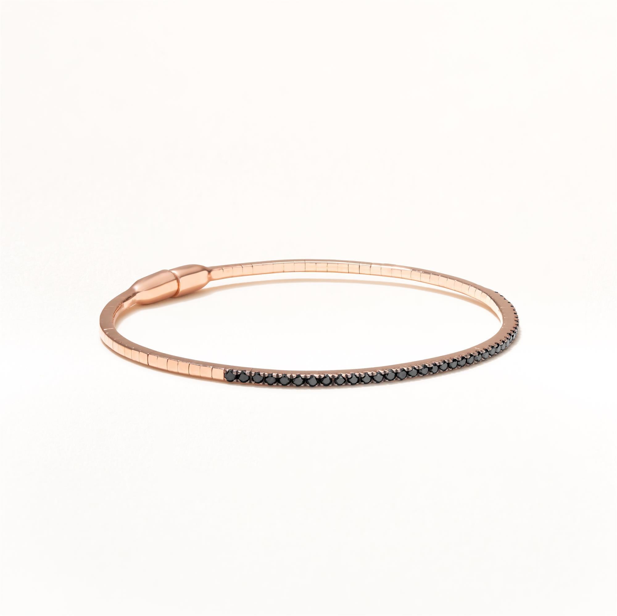 41 Round full-cut Black Diamonds are set in a micro pave on this Luxle 18K Rose Gold bangle with magnetic clasp. The diamonds are black in color, weighing 0.57 Cts. Adorn this beautiful bangle that will make heads turn wherever you go. You can