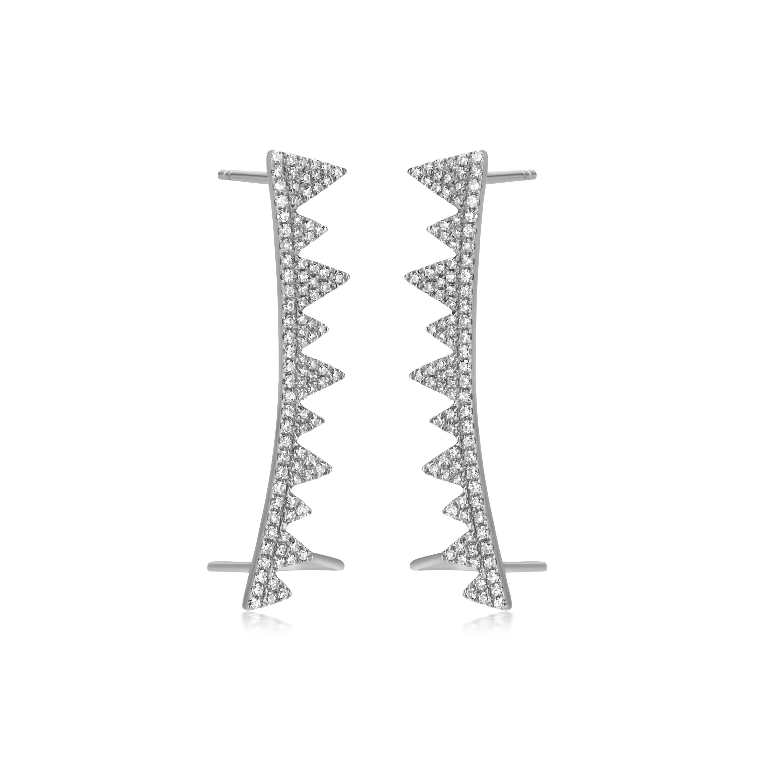 Elevate your style with these captivating Diamond Spike Ear Climbers. These edgy earrings feature a row of shimmering diamond-studded spikes, creating a striking and eye-catching design. The unique ear climber style offers a customizable fit,