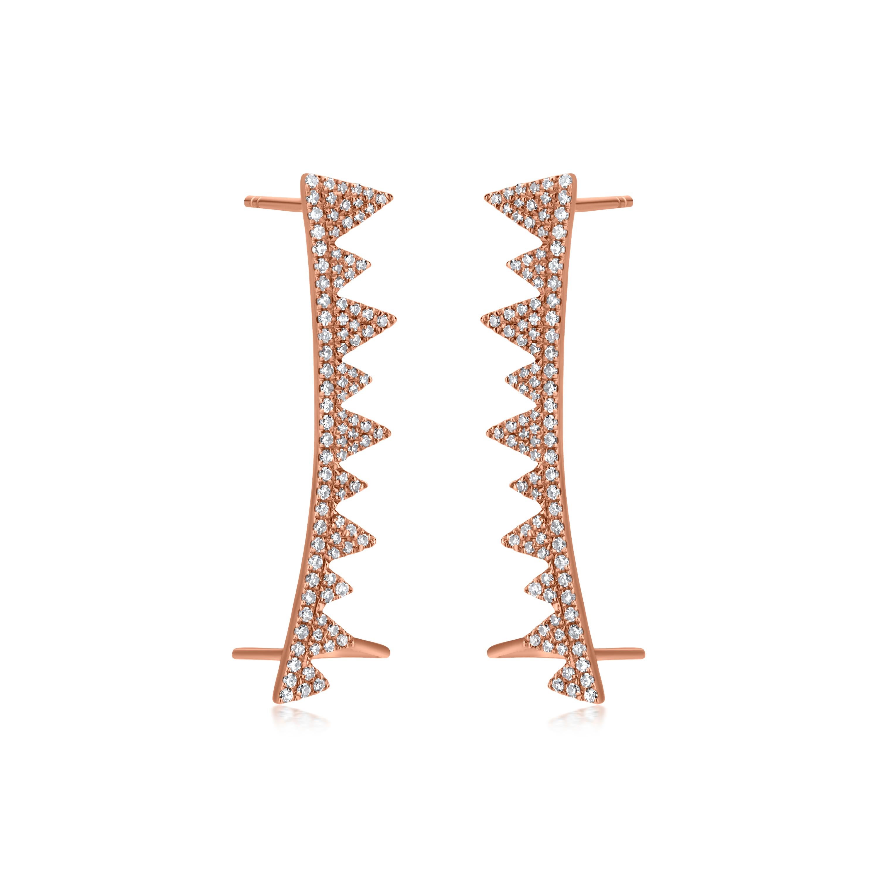 Elevate your style with these captivating Diamond Spike Ear Climbers. These edgy earrings feature a row of shimmering diamond-studded spikes, creating a striking and eye-catching design. The unique ear climber style offers a customizable fit,