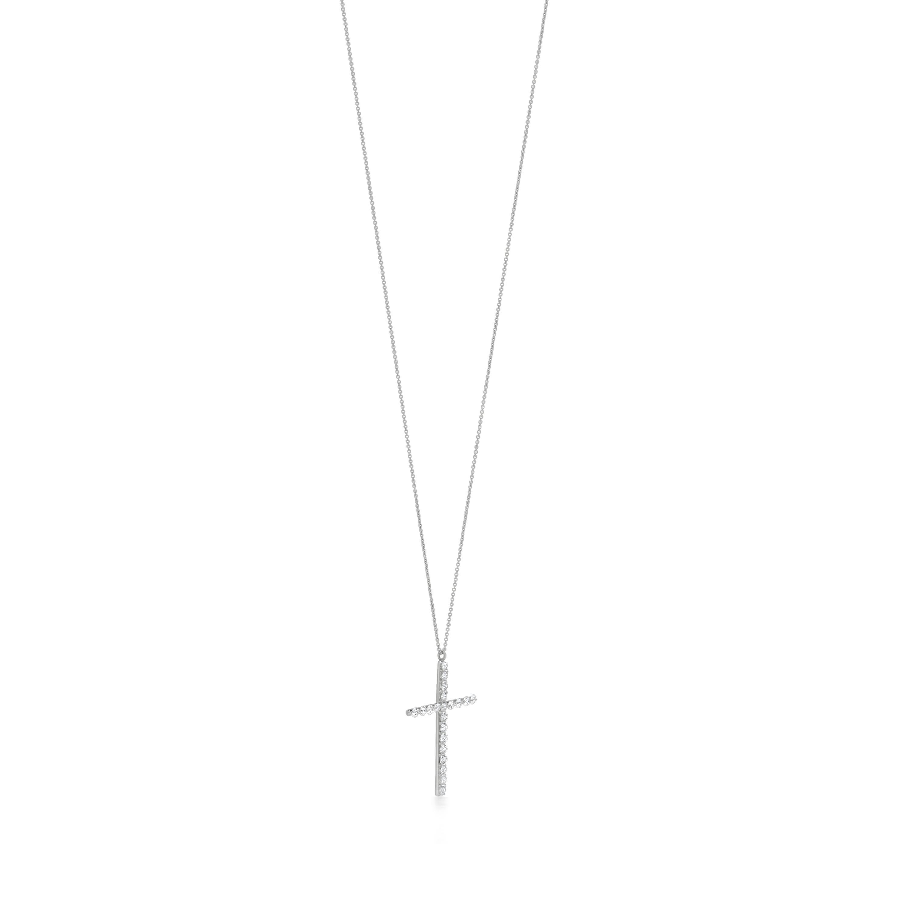 Round full-cut white diamonds weighing a combined 0.65 carats make up this Luxle Cross Pendant Necklace, which is made of 18K white gold. The gems are strung together. This striking necklace is sure to catch people's attention and turn their heads