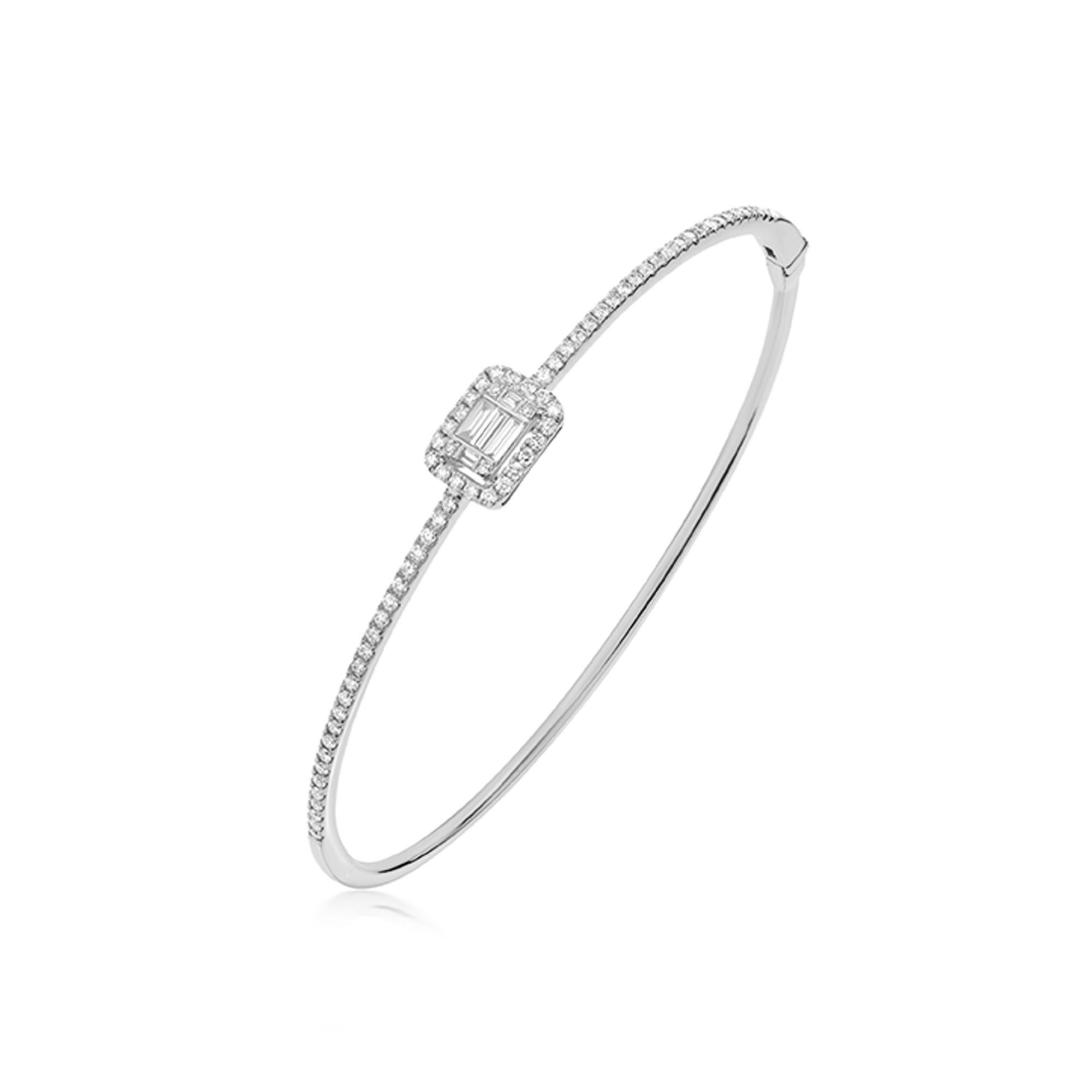 Baguette and round full-cut White Diamonds enhance the glam quotient of this sleek bangle, set in micro pave and illusion setting. The diamonds are SI1 in clarity, and GH in color, weighing 0.66 Cts. Dazzle and dab in this Luxle 18K White Gold shiny