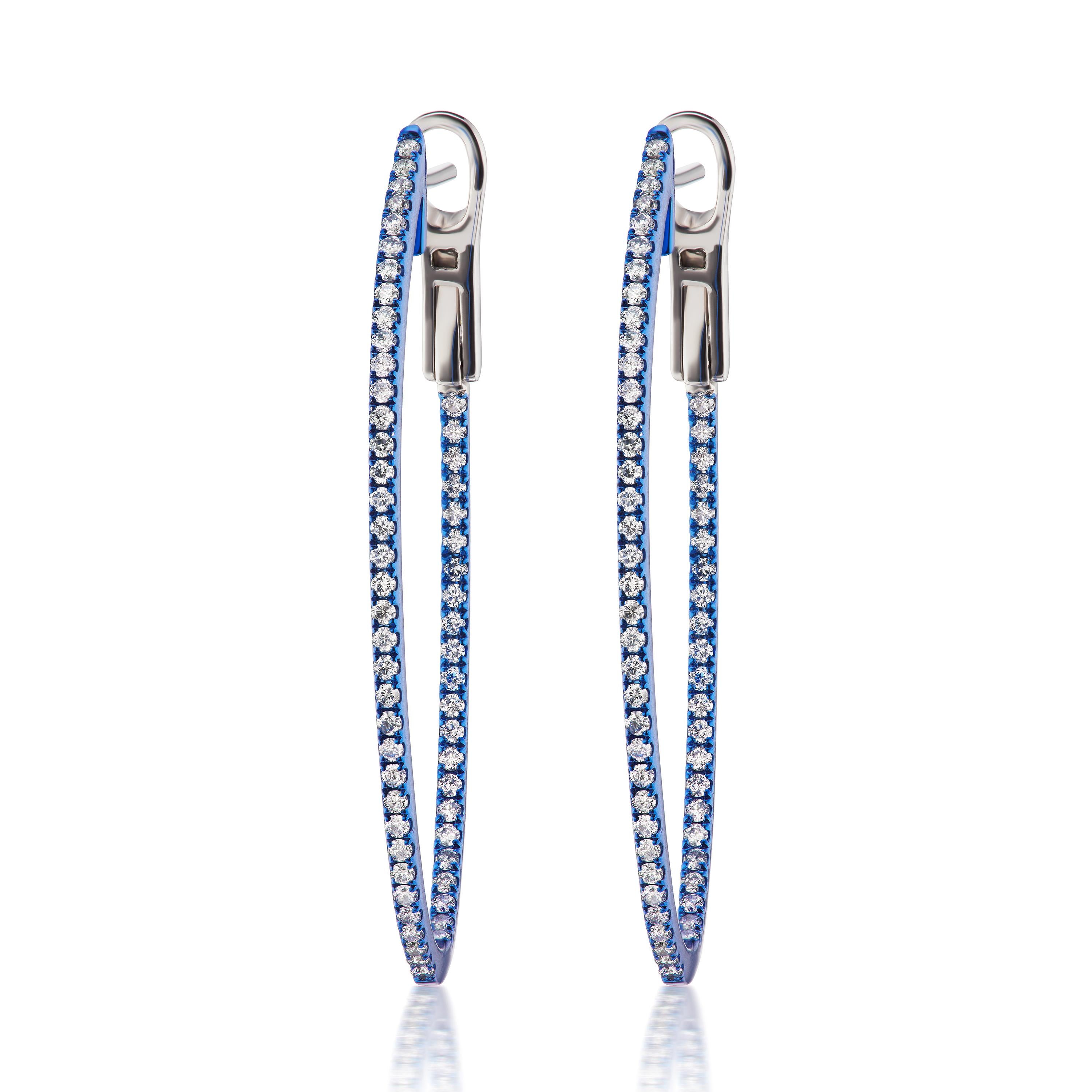 A dazzling pair of hoops featured by Luxle with 116 pave round diamonds embellished inside and outside. Crafted in 14K gold these hoops come with omega backs. The blue rhodium adds a pop of color to the pair.
Please follow the Luxury Jewels