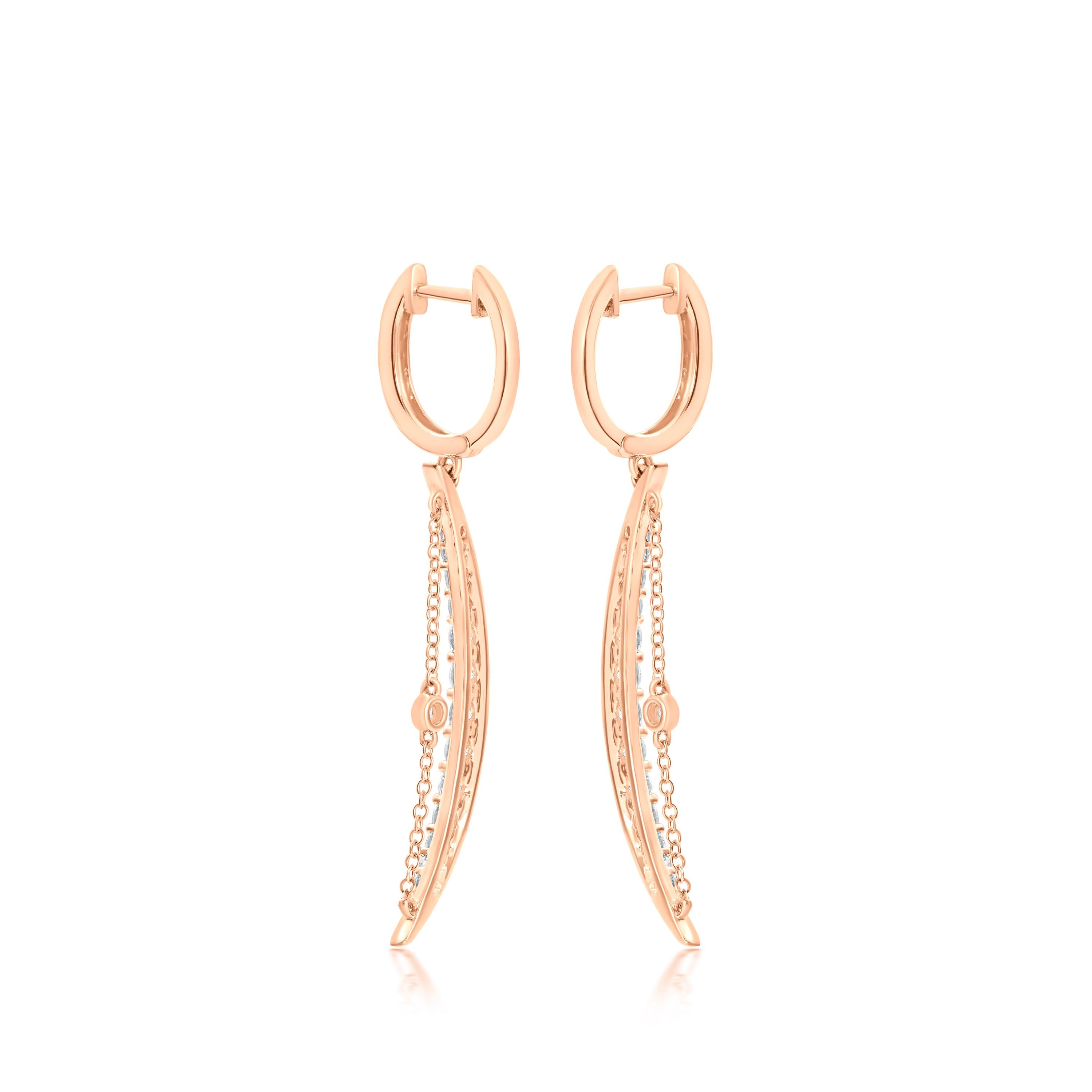 These Luxle crescent moon drop earrings made in 14k Rose Gold, which were designed with celestial inspiration in mind, glitter with 1.13 ct. t.w. of round diamonds in an attractive, classic motif with bezel set single diamond centered on delicate