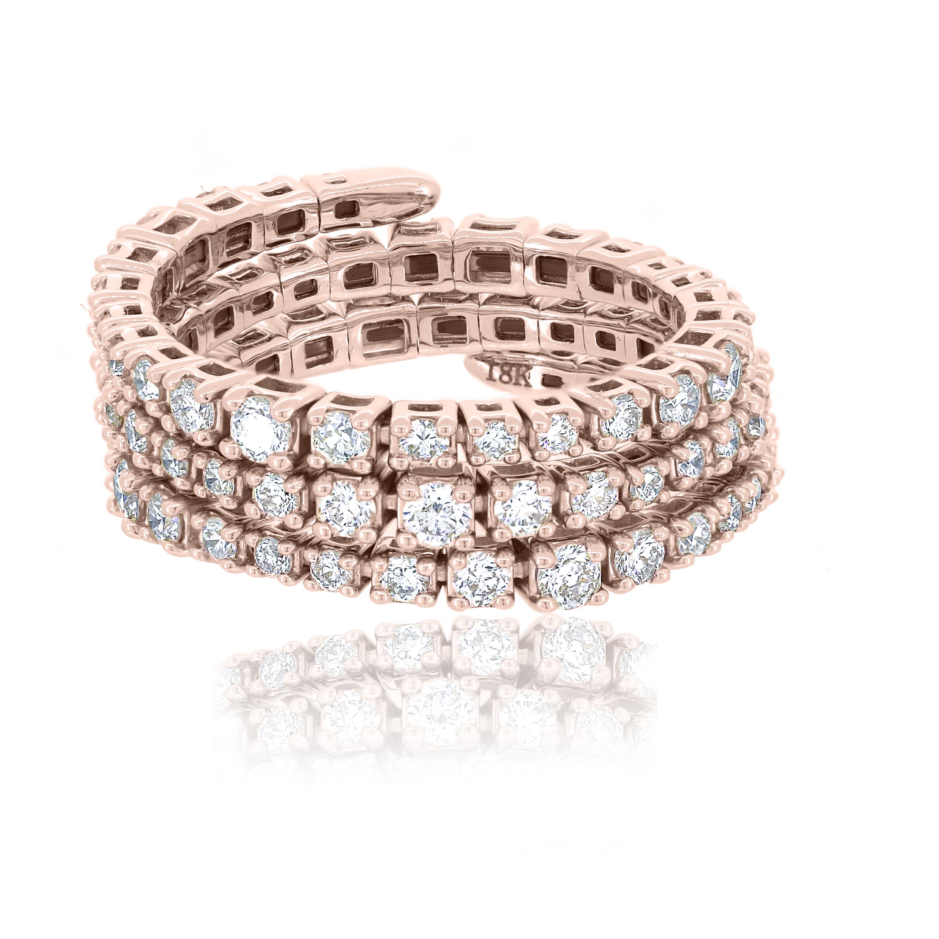 This Luxle Diamond spiral ring in 18K Rose gold shines with an eye-catching sparkle. The three adjacent lines of the ring are lined with 77 round cut glittering diamonds with a color grading of GH.  This spiral ring is adjustable so it can be worn