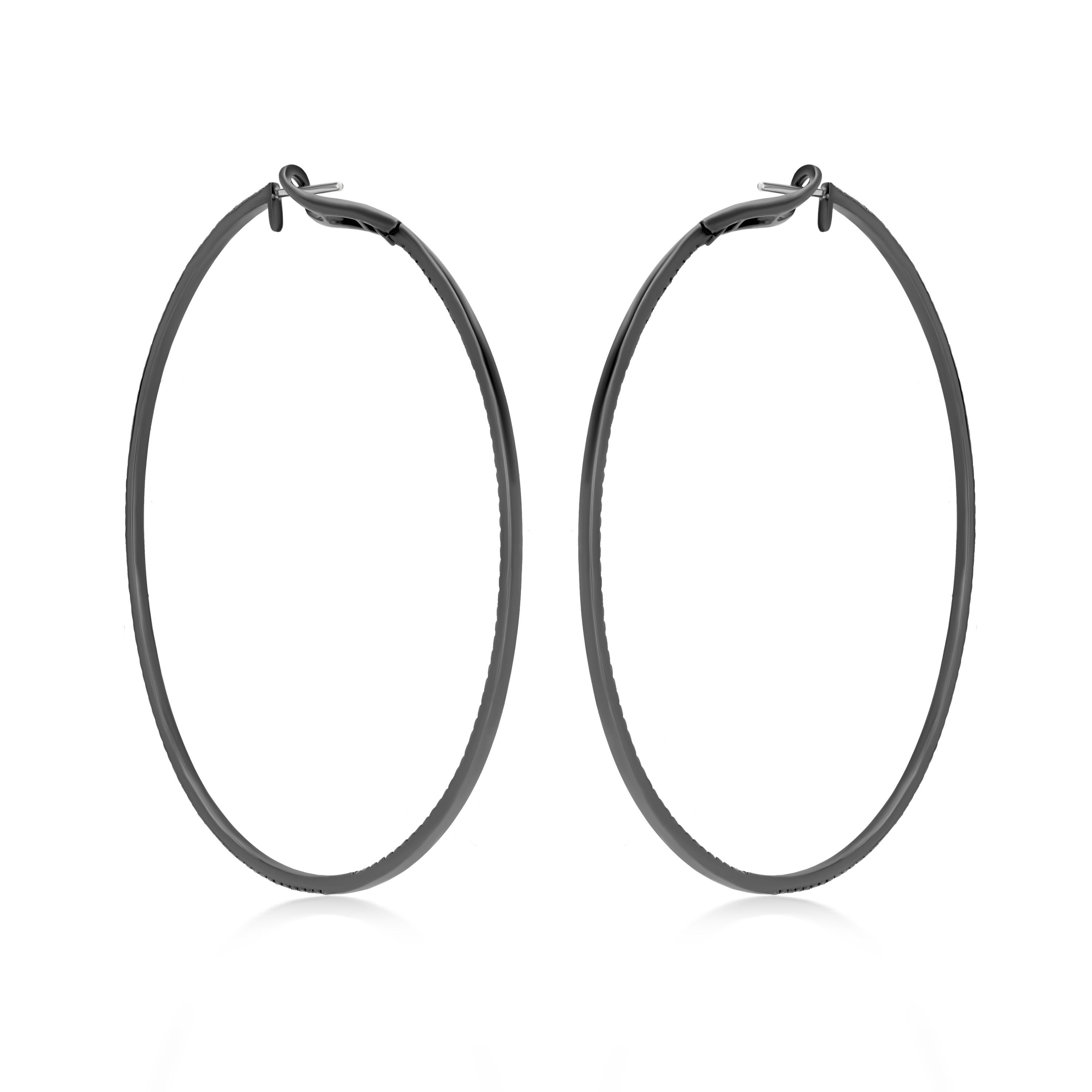 Your wardrobe deserves a little extra sparkle! Gleaming from the inside and outside, 2.46 ct. t.w. black diamond full cut rounds illuminate the polished black rhodium accentuated 18k gold oval hoops. Snap bar, black diamond hoop earrings.
Please
