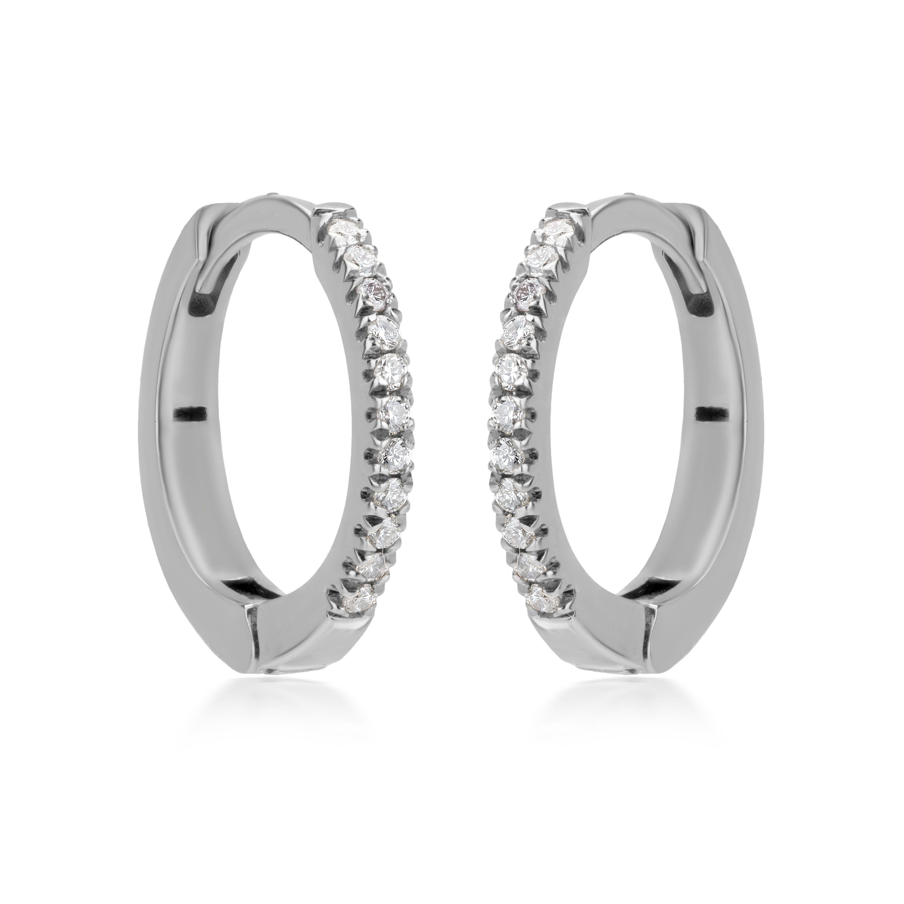 22 Round full-cut White Diamonds accentuate this Luxle hoop style earring manifested on an 18K White Gold body. Set in a micro pave, the diamonds totally weigh 0.073 Cts. The diamonds are I1 in clarity, and GH in color. This basic and simply elegant