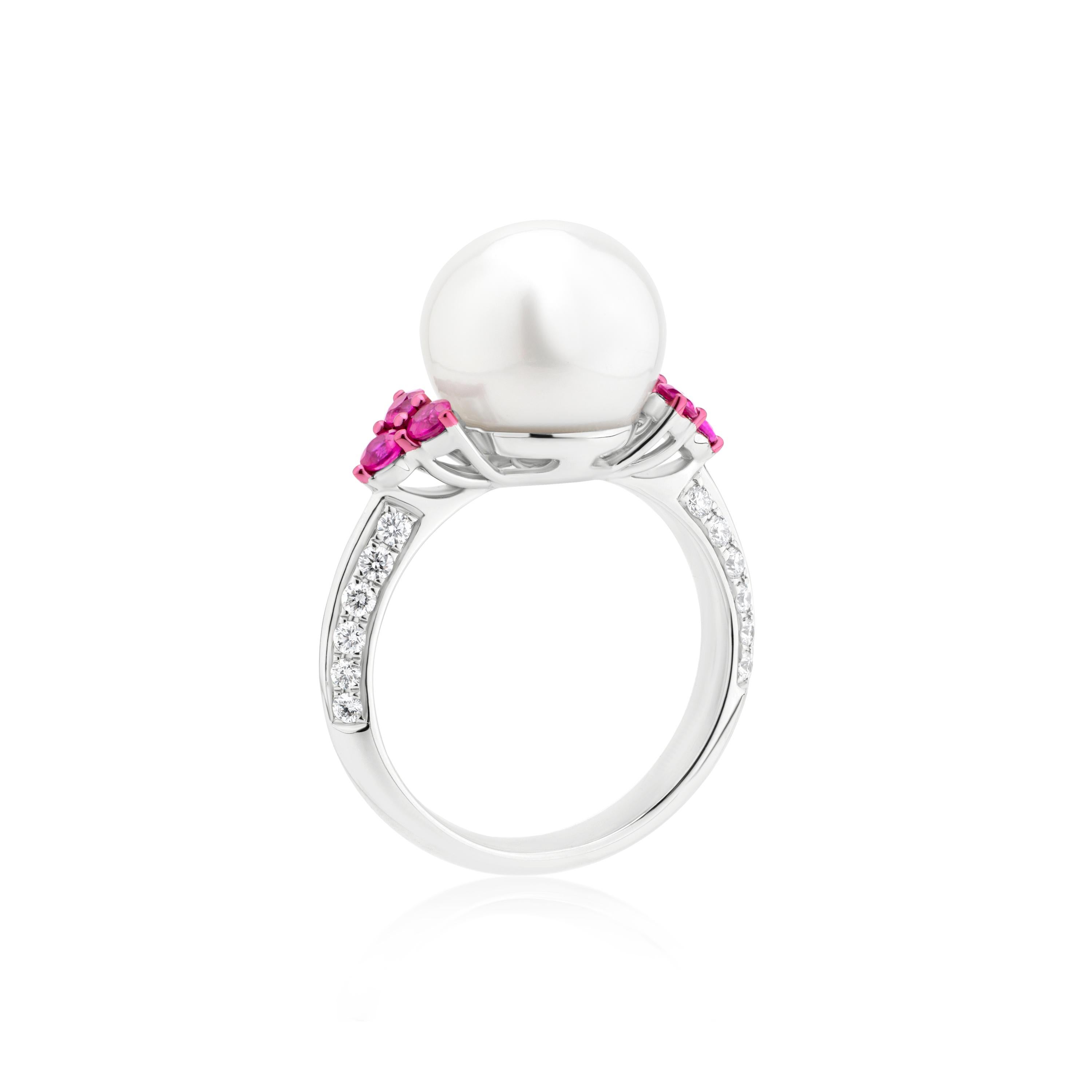Elevate your engagement moment with the Luxle South Sea Pearl, Ruby, and Diamond Engagement Ring in 18k white gold. This masterpiece redefines elegance and captures the essence of timeless love. 

At its heart lies a lustrous South Sea Pearl, an