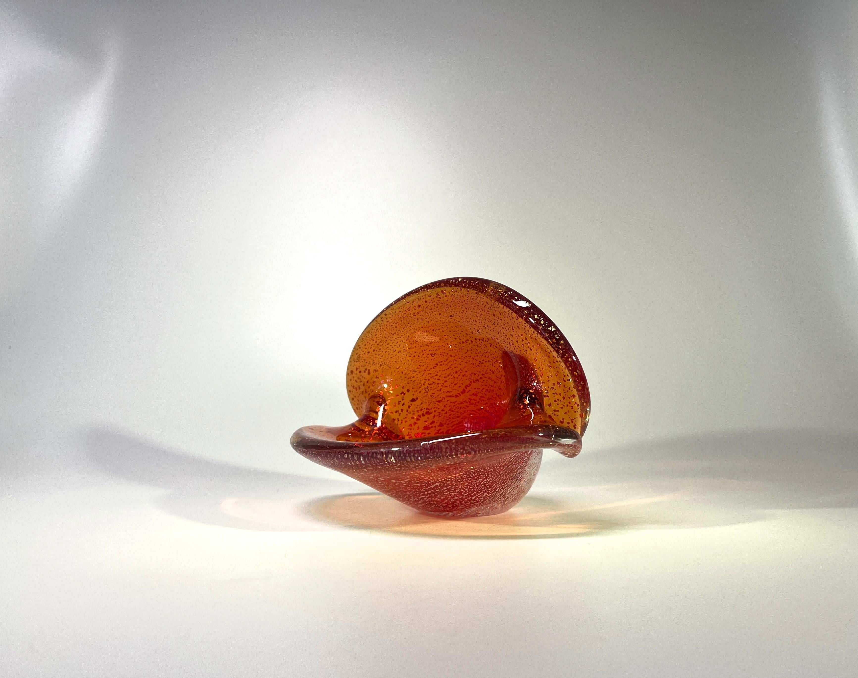 Beautiful hand crafted liquid amber clam shell vase, smothered with light reflecting shards of silver  
Attributed to by the renowned glass artist factory Seguso, Murano, Italy
This piece can be displayed either vertically or horizontally
Circa