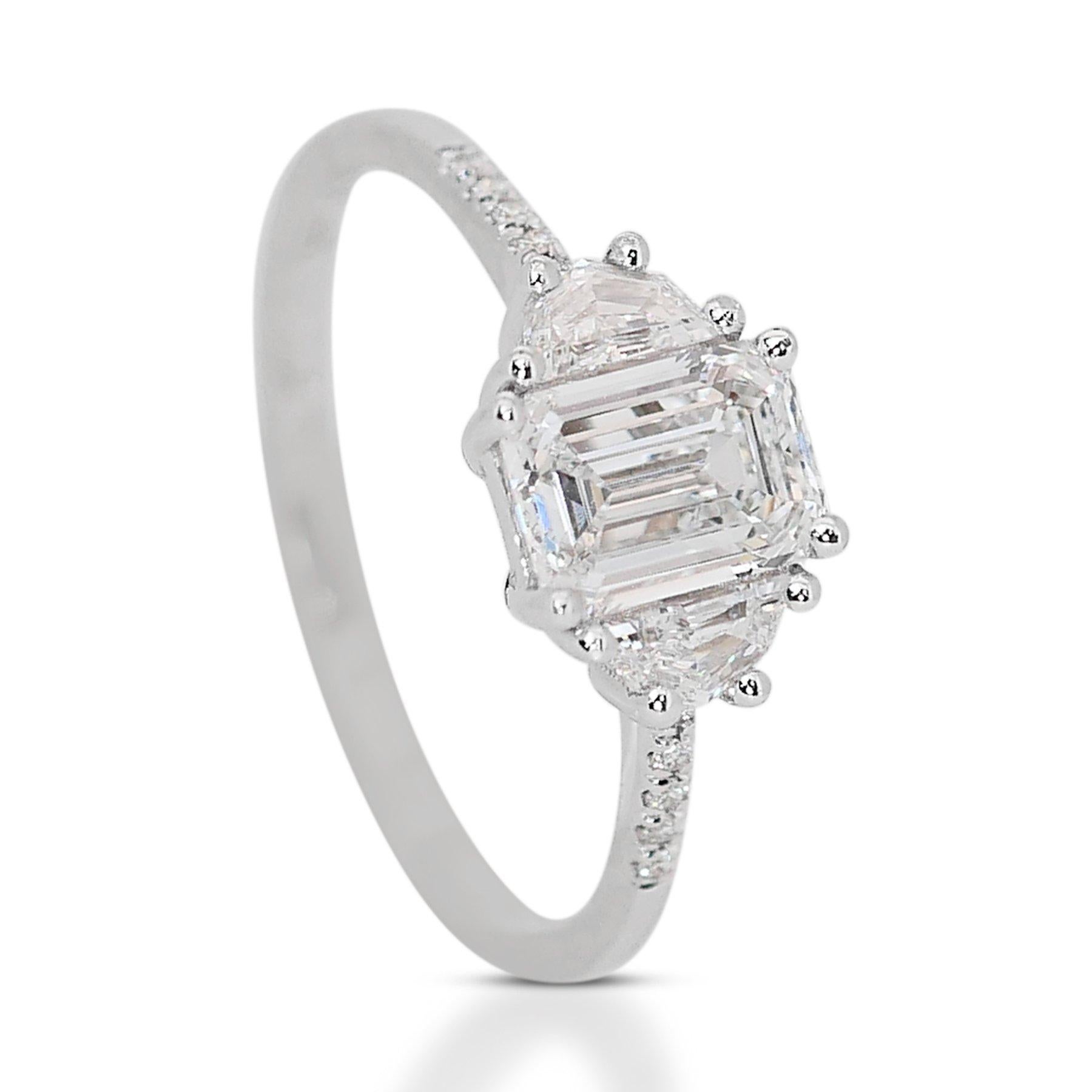 Luxurious 1.20ct Diamond 3-Stone Ring with Cadillac Shield & Round Accents in 18k White Gold - GIA Certified 

This meticulously crafted diamond ring in 18k white gold epitomizes elegance and sophistication. At the center, a 0.84-carat emerald-cut