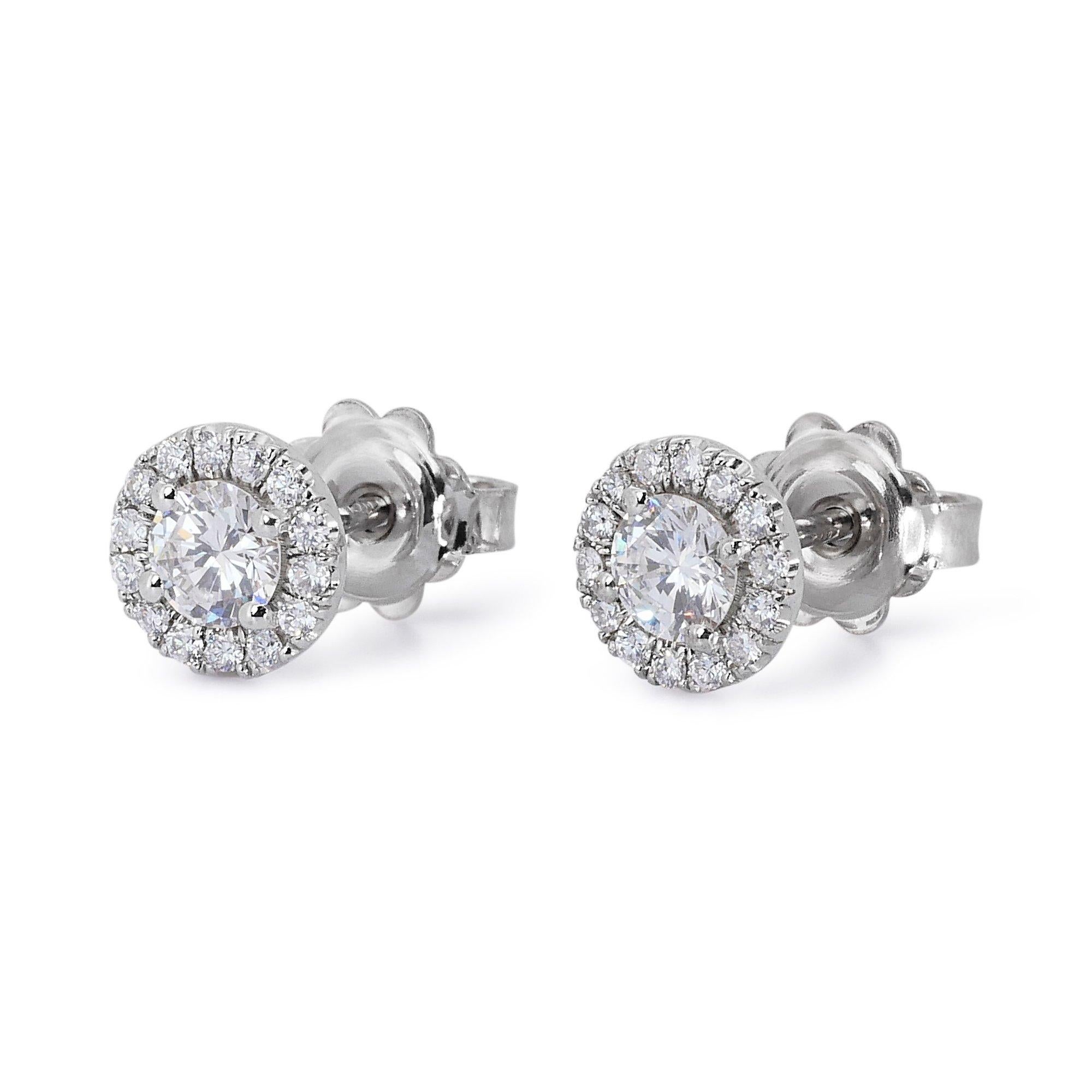 Luxurious 1.24ct Round Diamond Stud Earrings in 18K White Gold - GIA Certified

Featuring these exquisite diamond stud earrings boast a timeless design and exceptional sparkle. Crafted in luxurious 18k white gold, each earring features a stunning