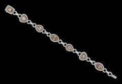 Luxurious 18 Karat White and Pink Gold, Platinum and Pink Diamond Bracelet