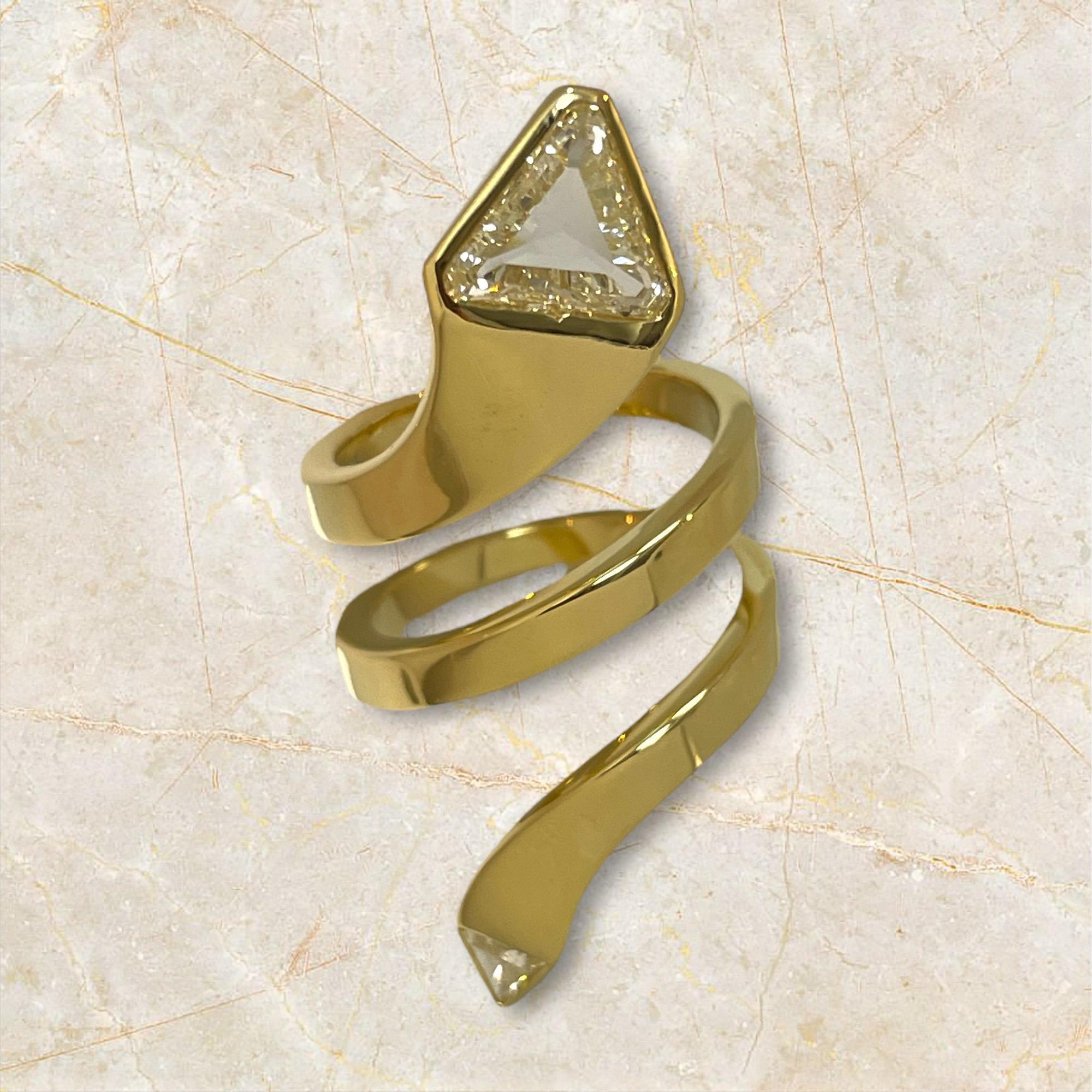 This exquisite 18K gold serpent ring, adorned with GIA-certified trillion-cut diamonds, is the perfect blend of luxury and elegance.

Material: 18K Yellow Gold
Diamond: 1.55 + 0.14 ct 

Selling Price: $9800.00