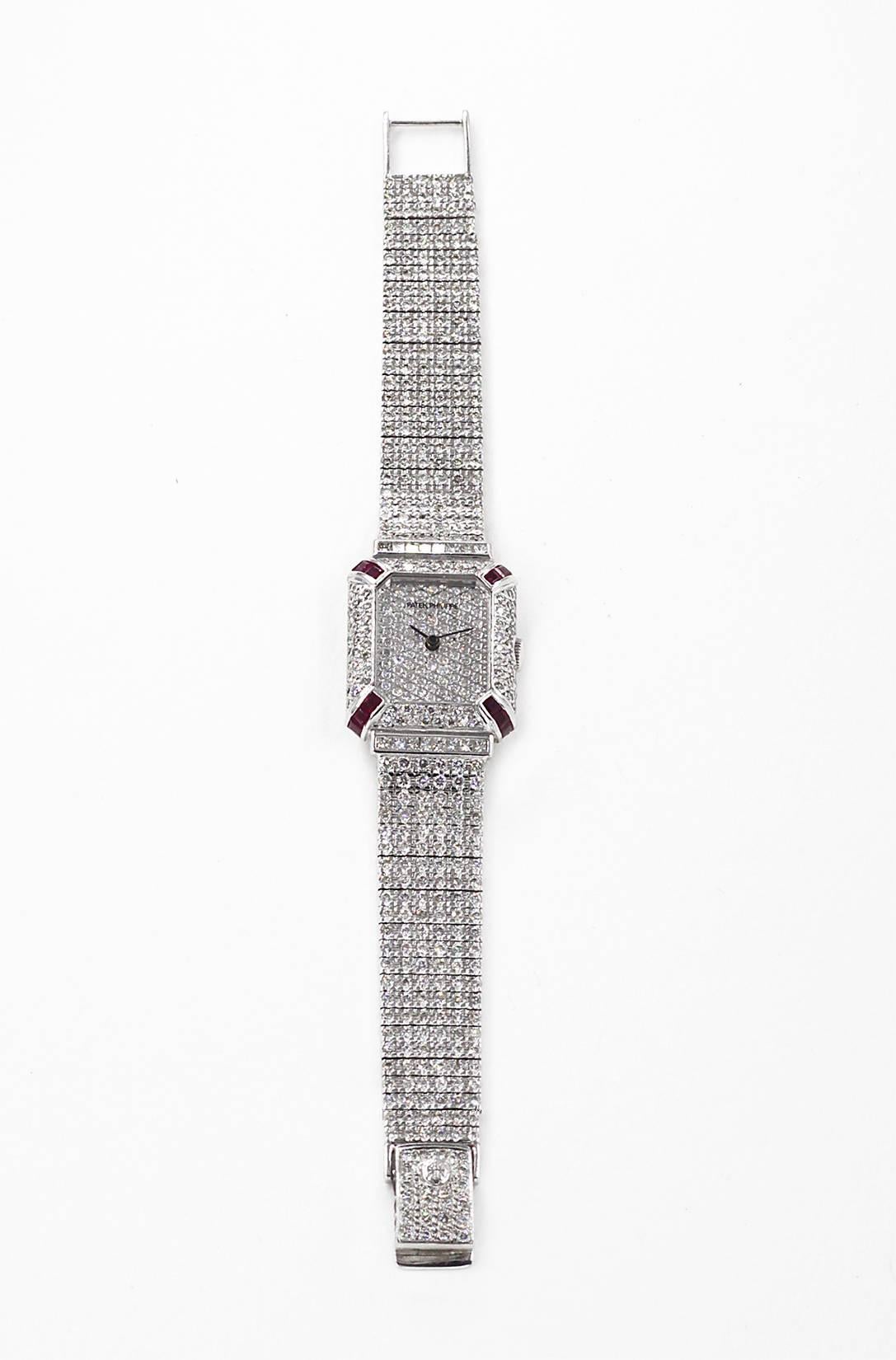 18K Ladies' Patek Philippe features 20 cts Diamonds & 1 cts Rubies. This watch is a luxurious and elegant timepiece that can be worn to the office or casually. Its durable bracelet is made of 18k white gold and diamonds and features a folding