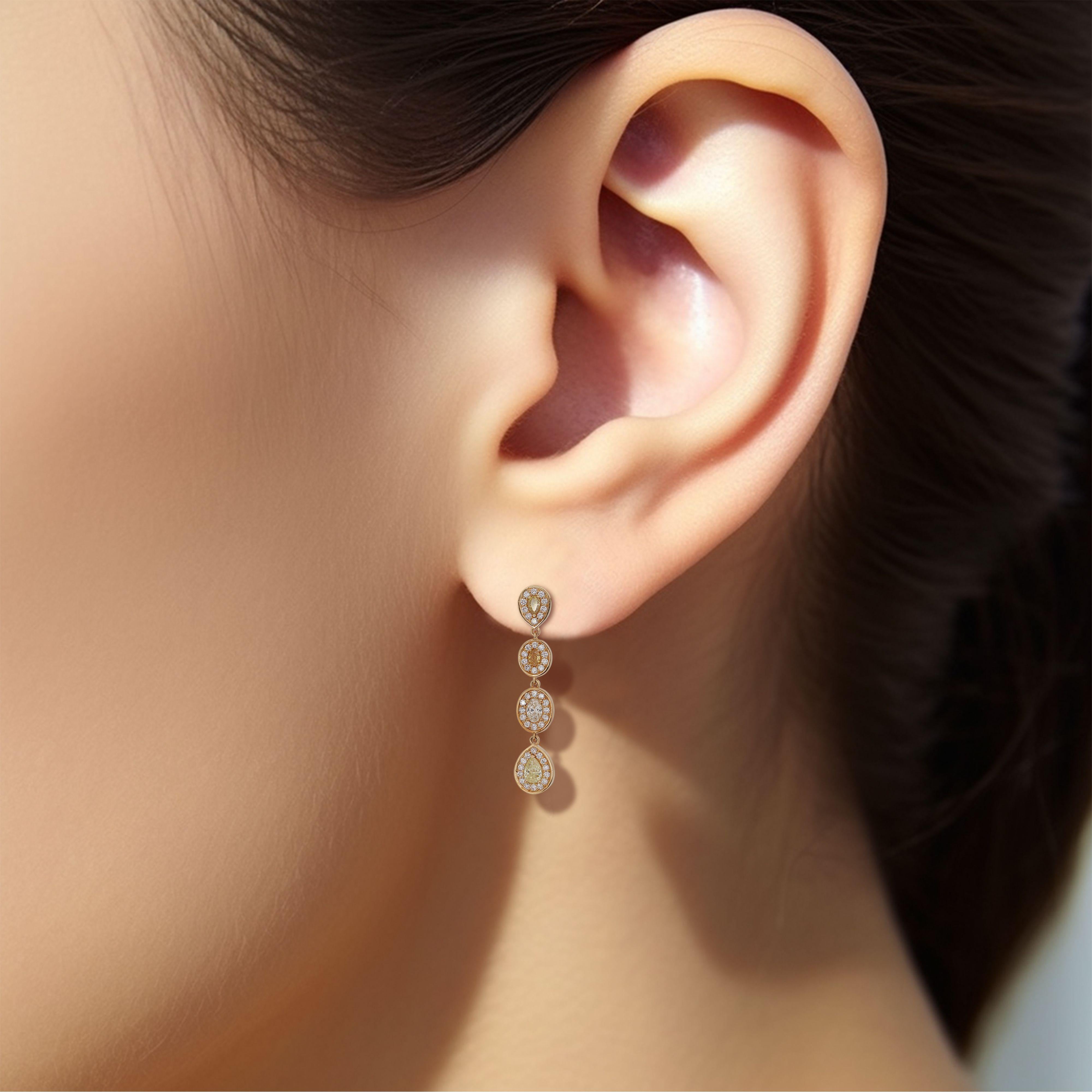 Ein luxuriöser natürlicher Tropfen Stil Ohrringe mit 8 natürlichen fancy mix gelb orange braun natürliche Diamanten mit insgesamt 1,82 Karat als die wichtigsten Steine. Diese Ohrringe sind mit runden Brillanten im Idealschliff in F VS umgeben, die
