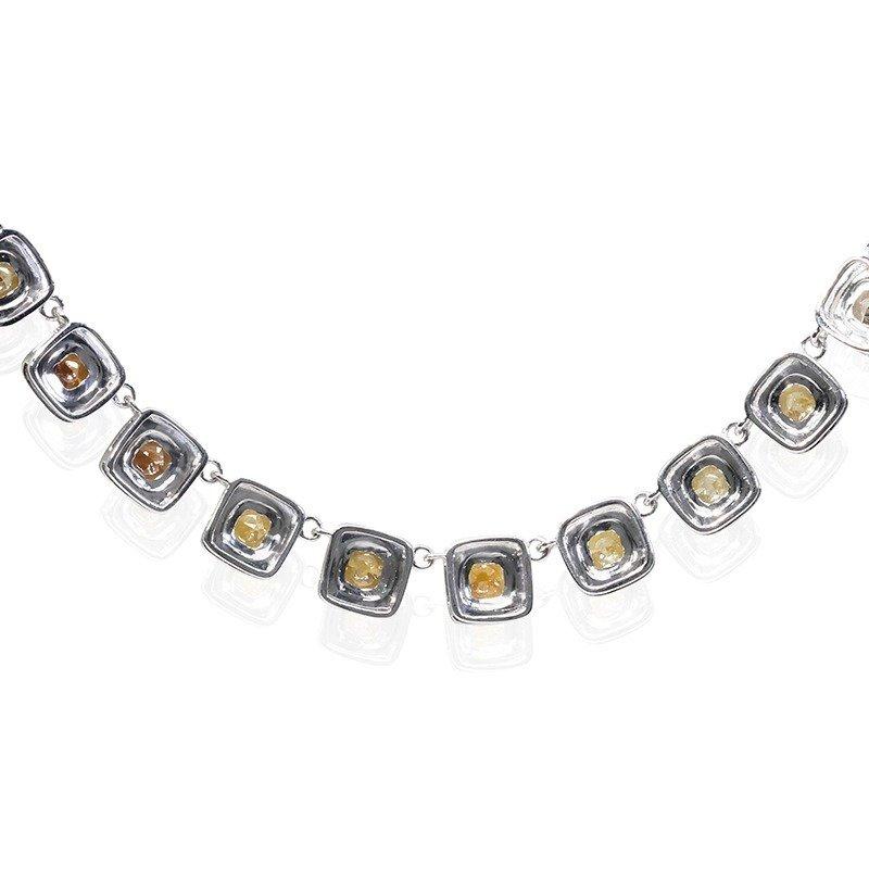 A beautiful and one of a kind fancy necklace with dazzling 13.65 carat cushion shaped natural fancy diamonds. It has 17.35 carat of round side diamonds with collection color which add more to its elegance. The jewelry is made of 18K white gold with