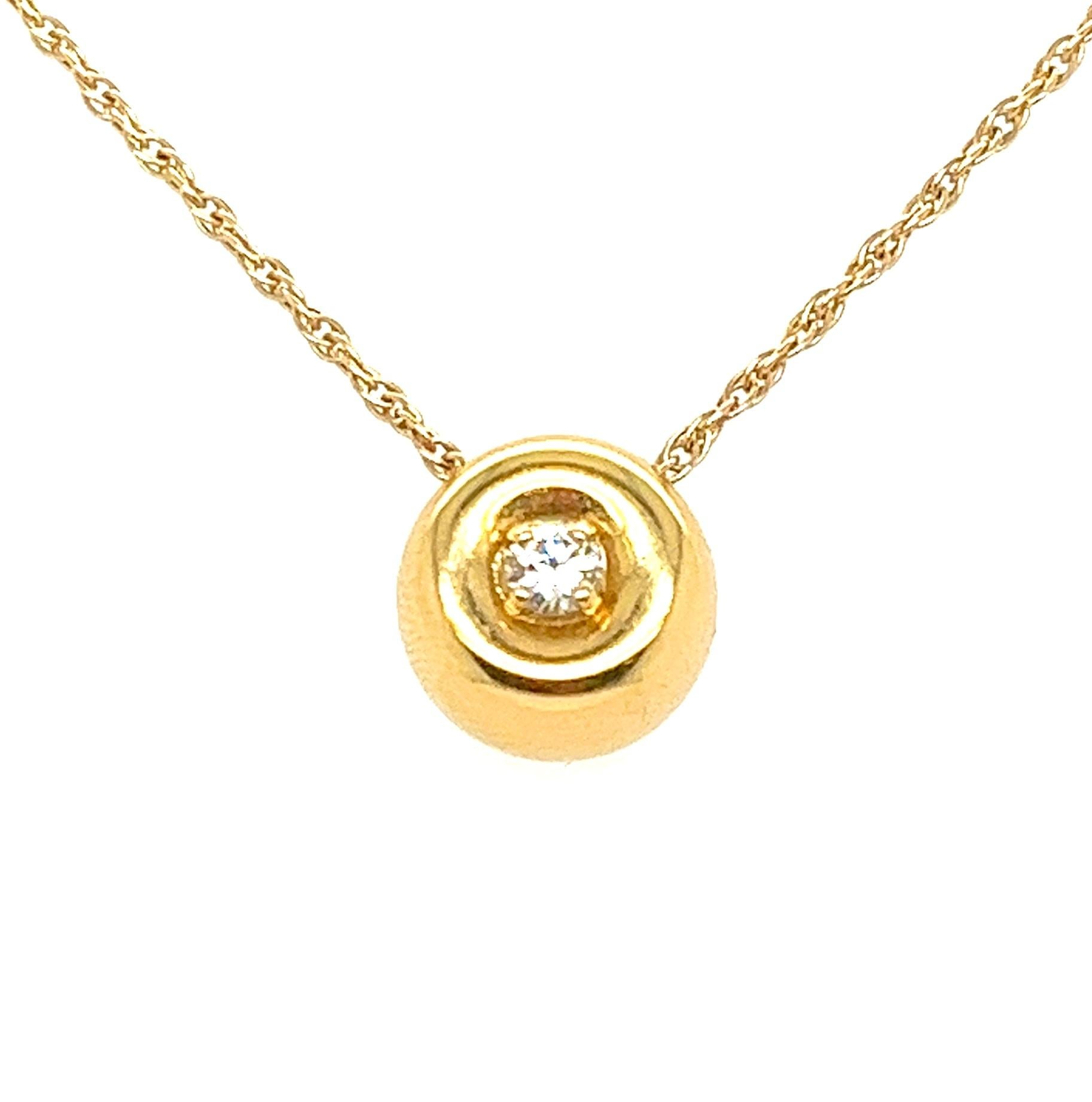 Luxurious 18kt Gold Bauble Pendant with Top-Quality Diamond

Elevate your jewelry collection with this exquisite round bauble pendant crafted in solid 18kt yellow gold. At its heart, a stunning natural earth-mined diamond, approximately 0.10ct, is