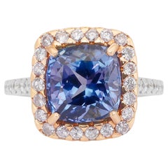 Lujoso anillo en racimo de tanzanita y diamantes de 5,94 ct en oro blanco y rosa de 18k